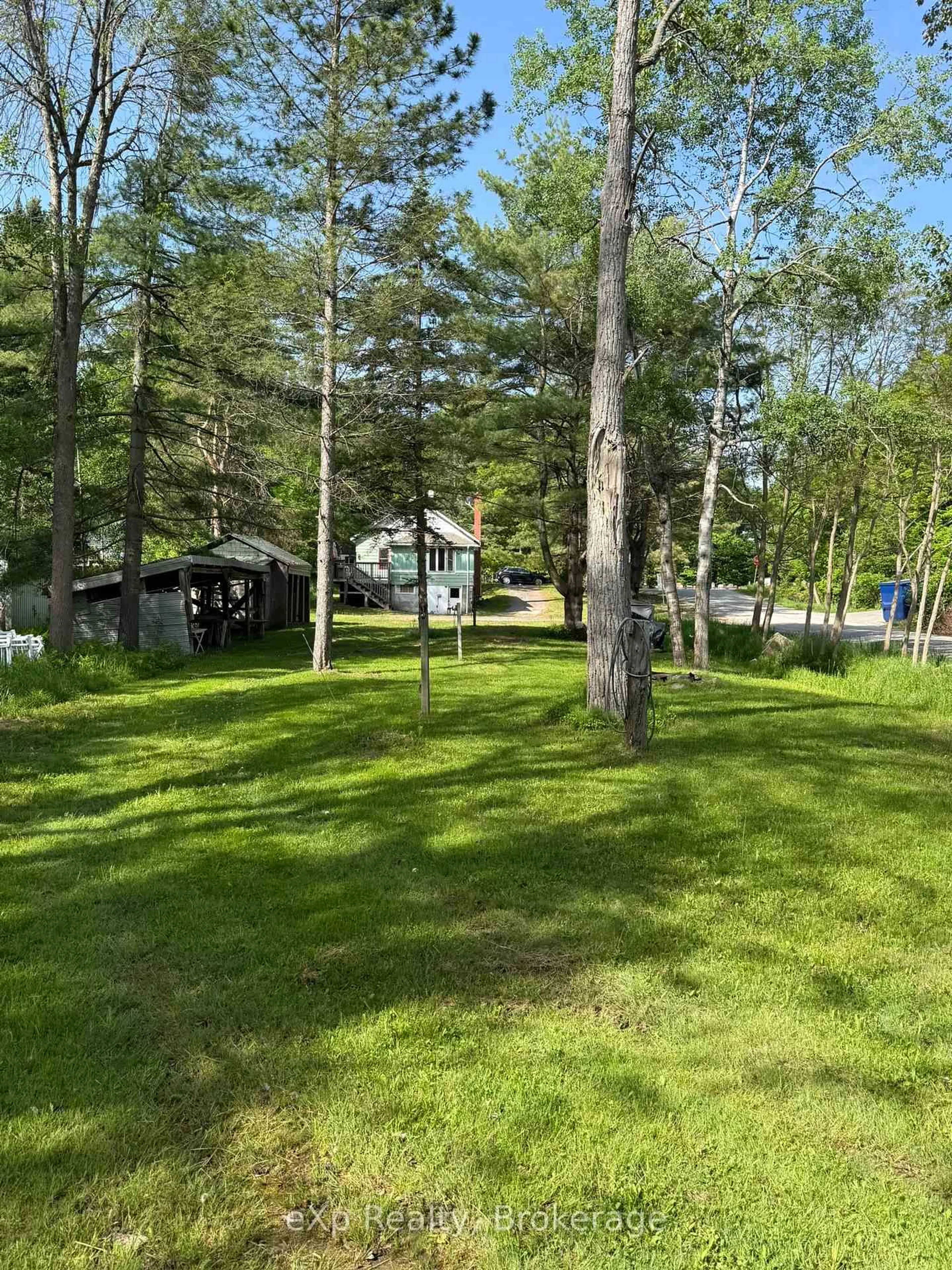 A pic from outside/outdoor area/front of a property/back of a property/a pic from drone, forest/trees view for 50 Joseph St, Muskoka Lakes Ontario P0B 1J0