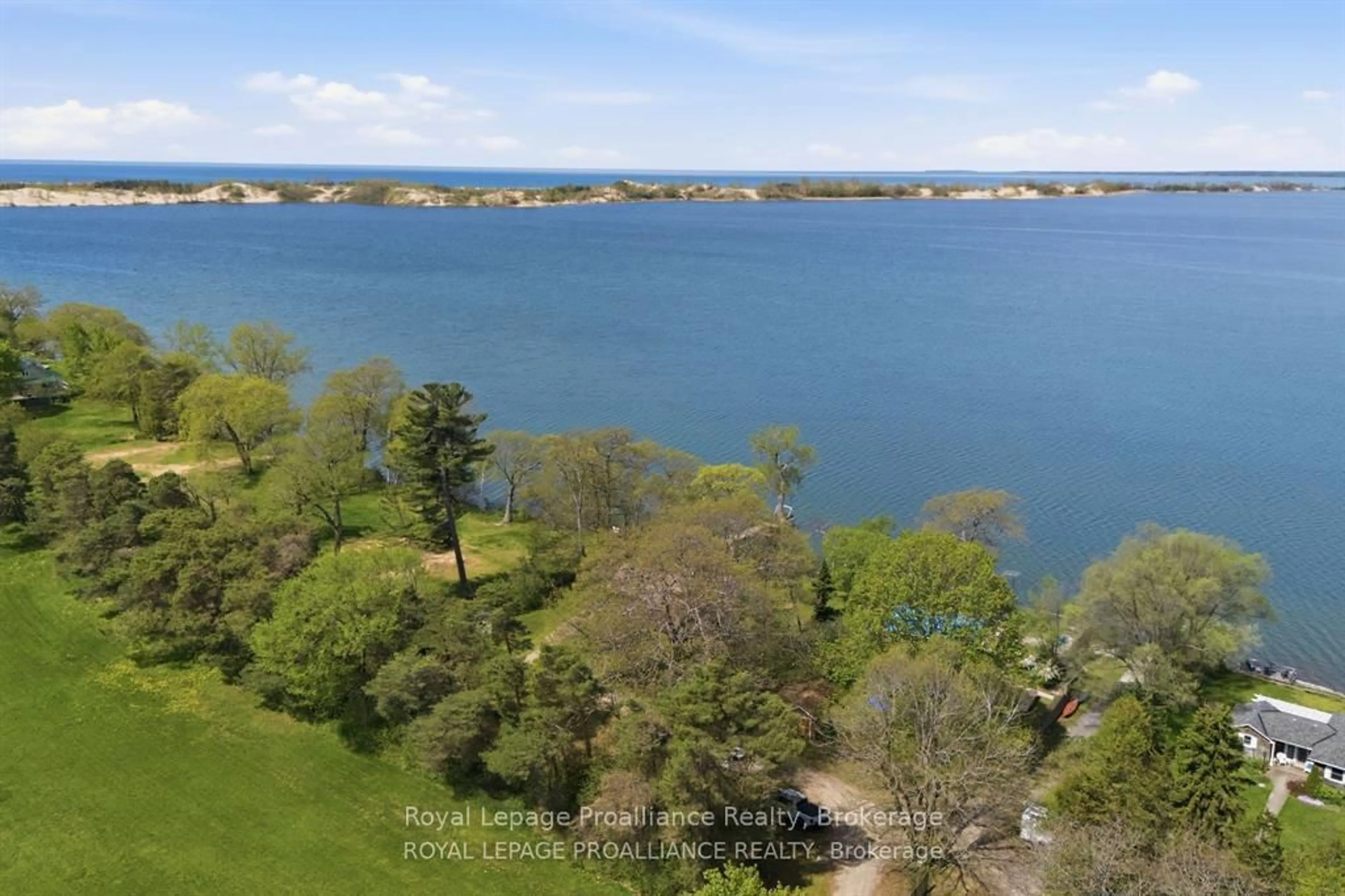 A pic from outside/outdoor area/front of a property/back of a property/a pic from drone, water/lake/river/ocean view for 40 Mayne Lane, Prince Edward County Ontario K0K 2T0