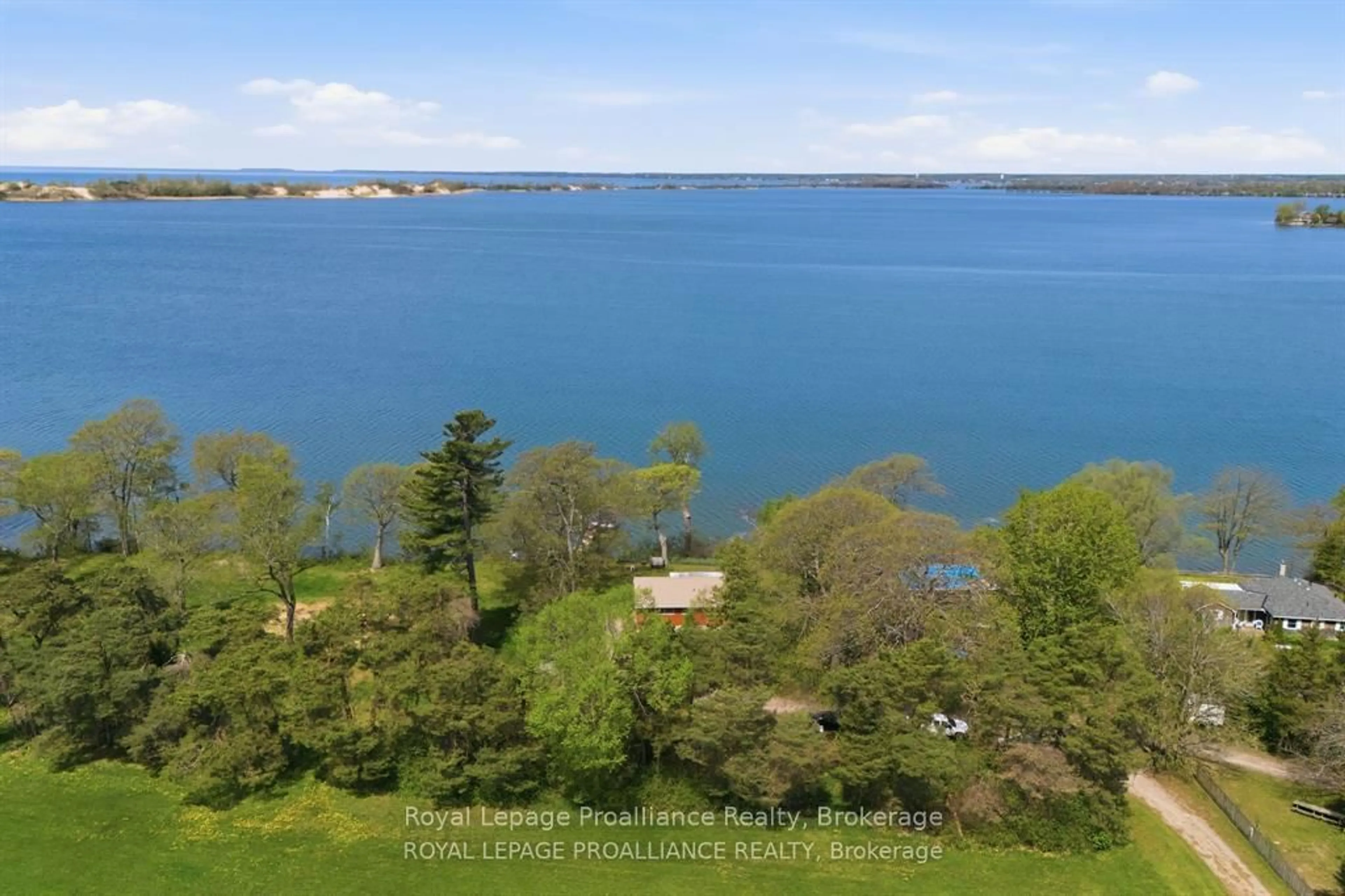 A pic from outside/outdoor area/front of a property/back of a property/a pic from drone, water/lake/river/ocean view for 40 Mayne Lane, Prince Edward County Ontario K0K 2T0