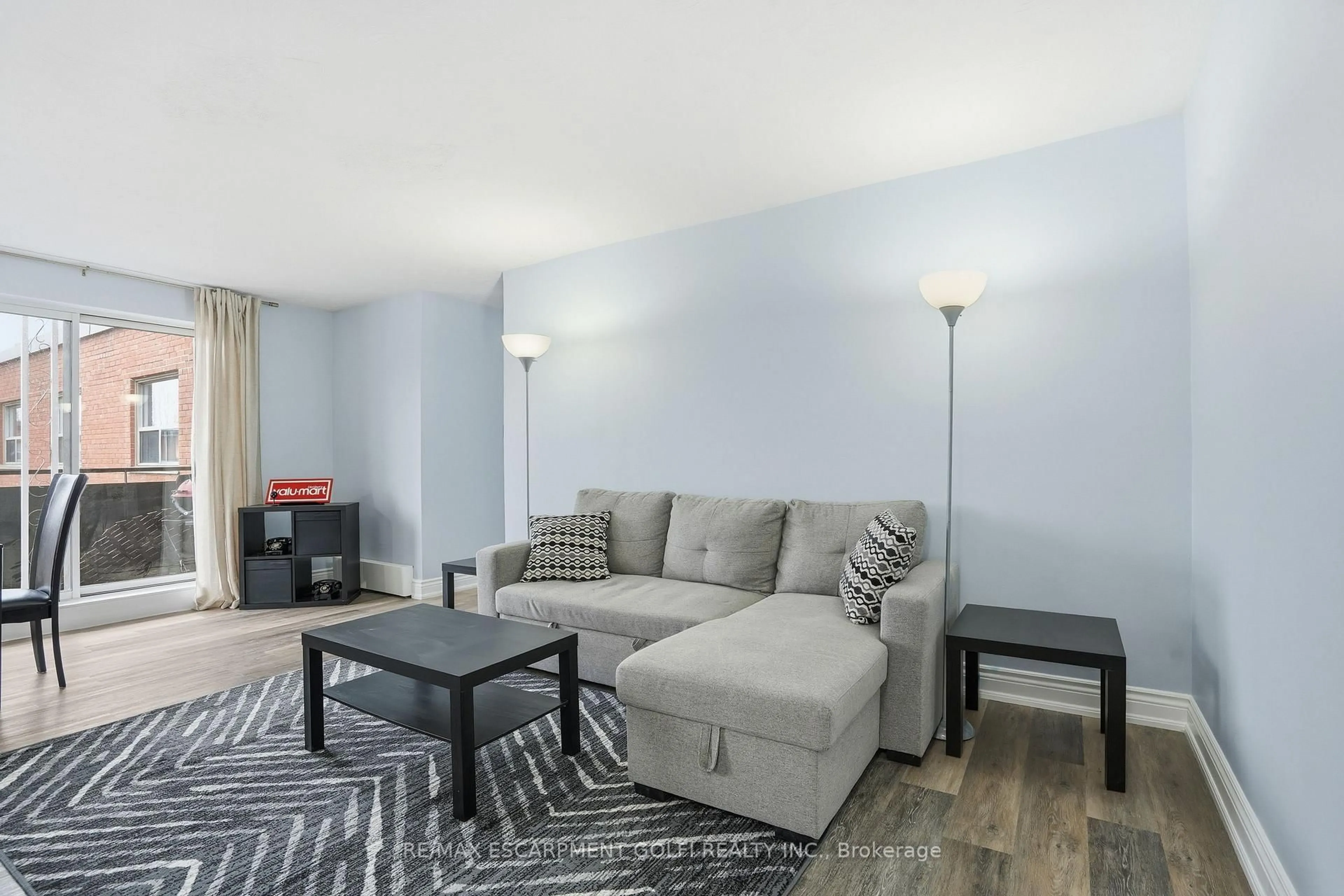 Living room with furniture, unknown for 485 Thorold Rd #319, Welland Ontario L3C 3X1