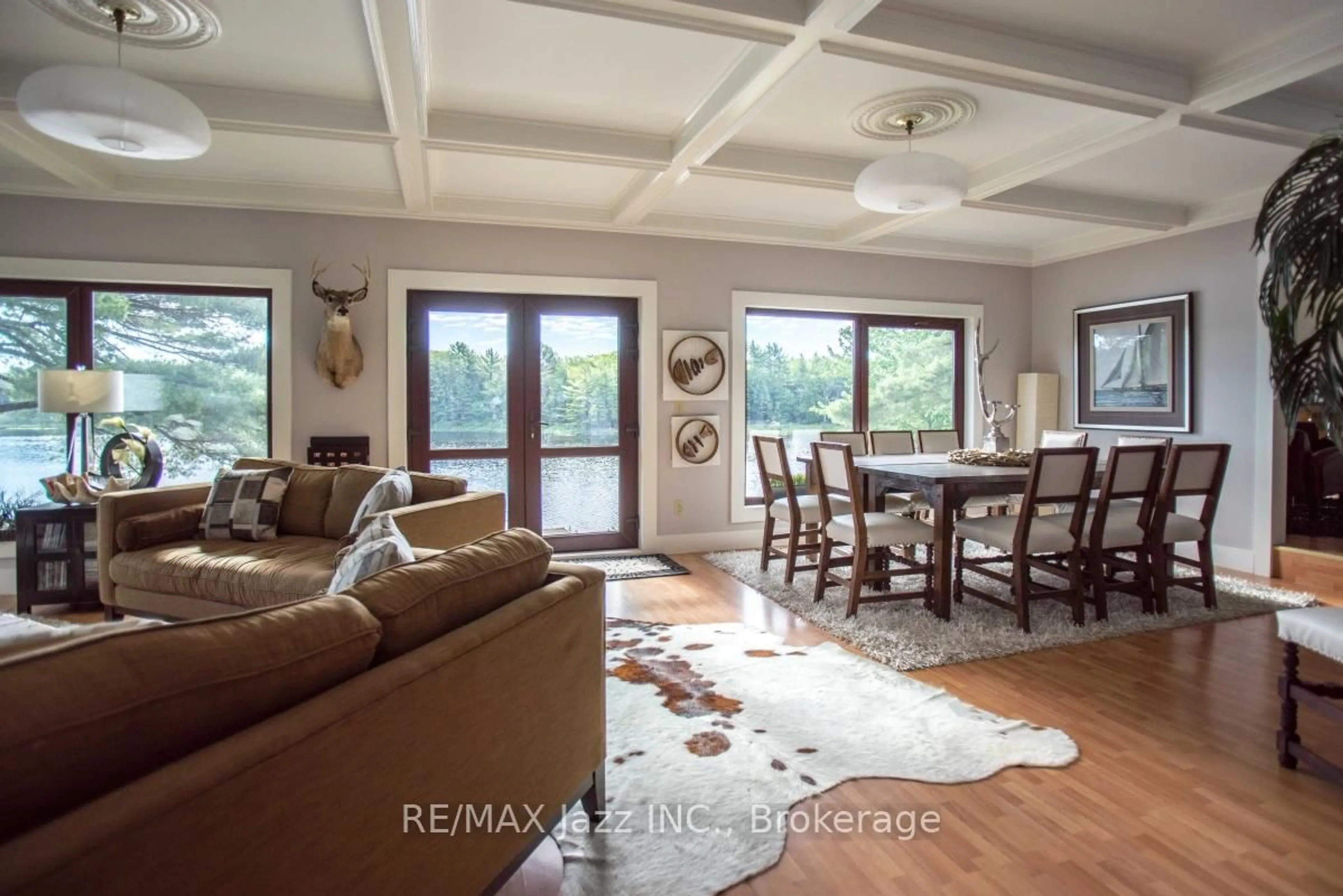 Living room with furniture, wood/laminate floor for 1314 Shebeshekong Rd, Carling Ontario P0G 1G0