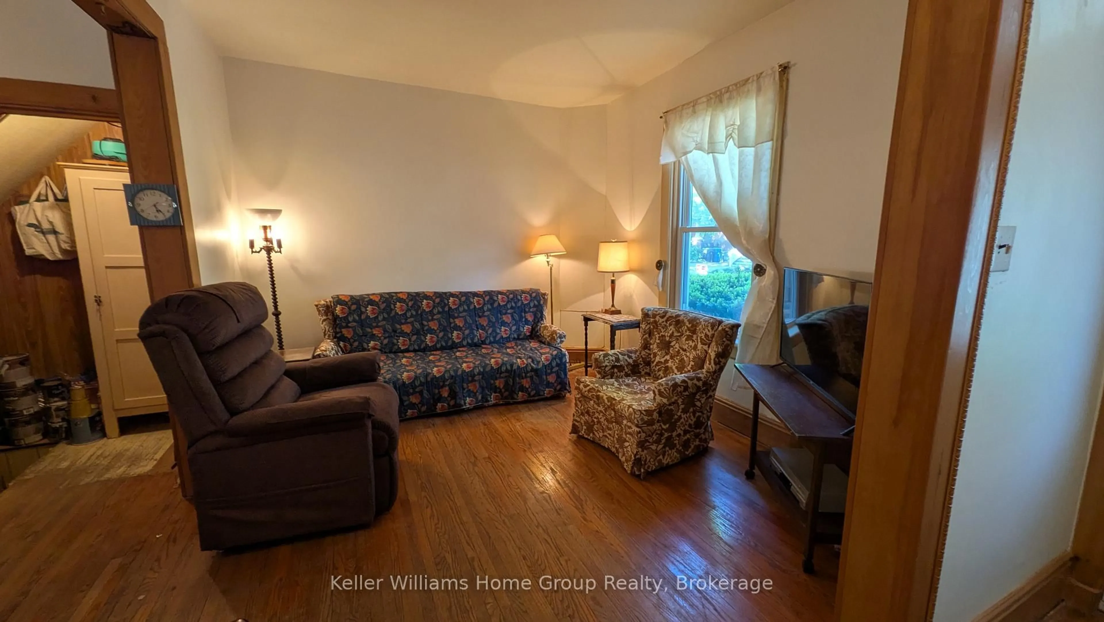Living room with furniture, wood/laminate floor for 18 Powell St, Guelph Ontario N1H 1T9