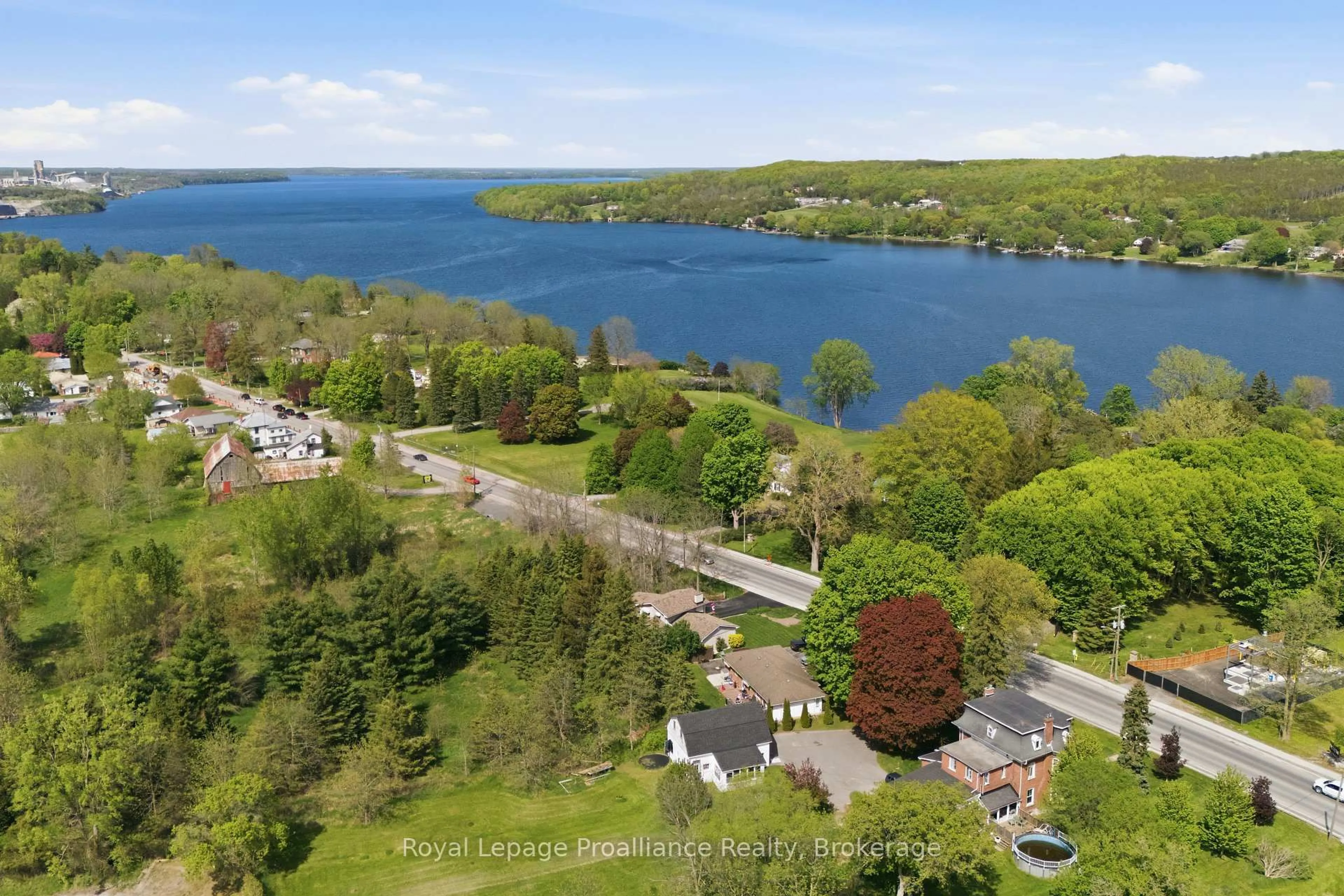 A pic from outside/outdoor area/front of a property/back of a property/a pic from drone, water/lake/river/ocean view for 445 Highway 49, Prince Edward County Ontario K0K 2T0
