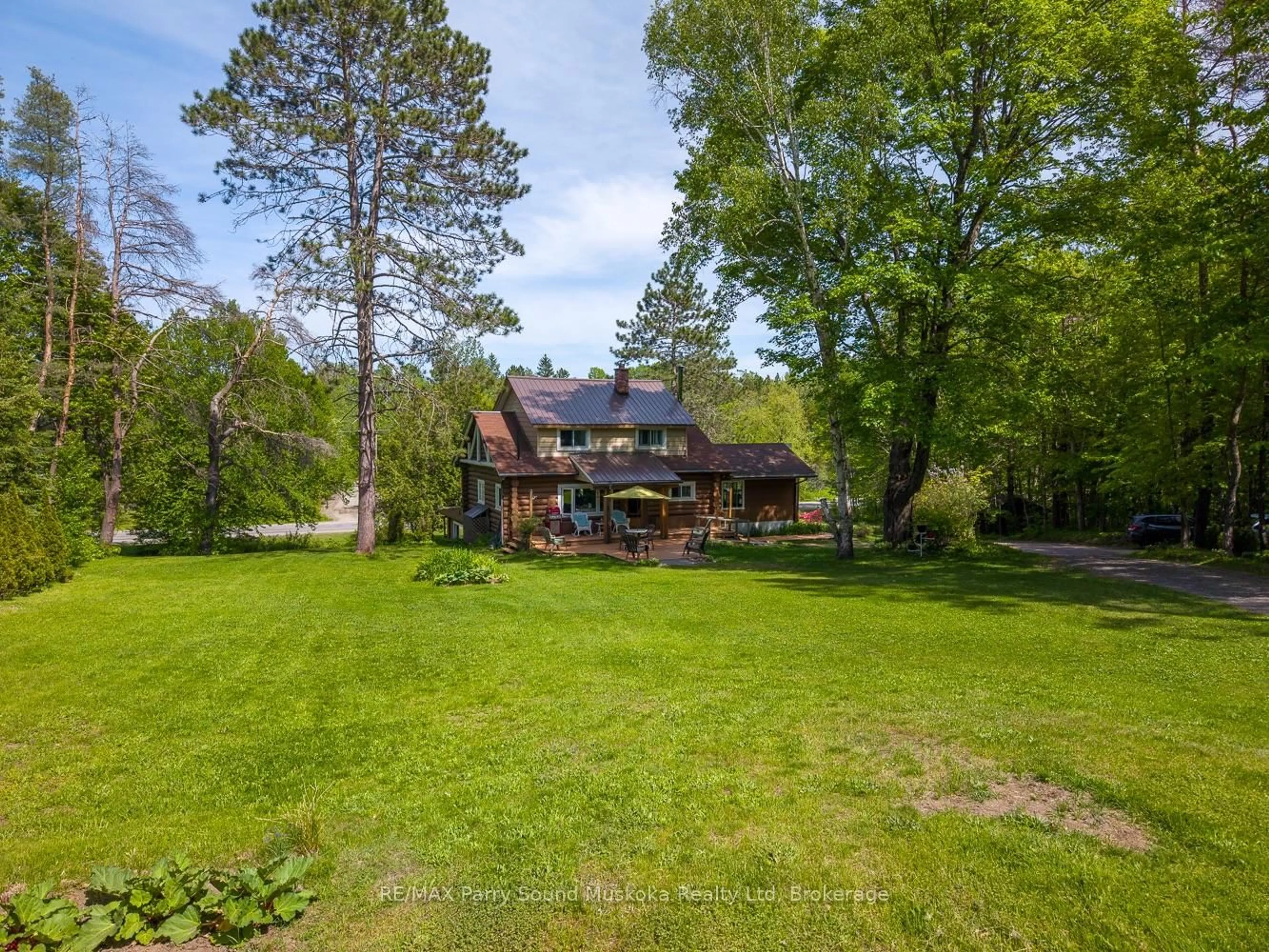 A pic from outside/outdoor area/front of a property/back of a property/a pic from drone, water/lake/river/ocean view for 203 Horseshoe Lake Rd, Seguin Ontario P2A 2W8
