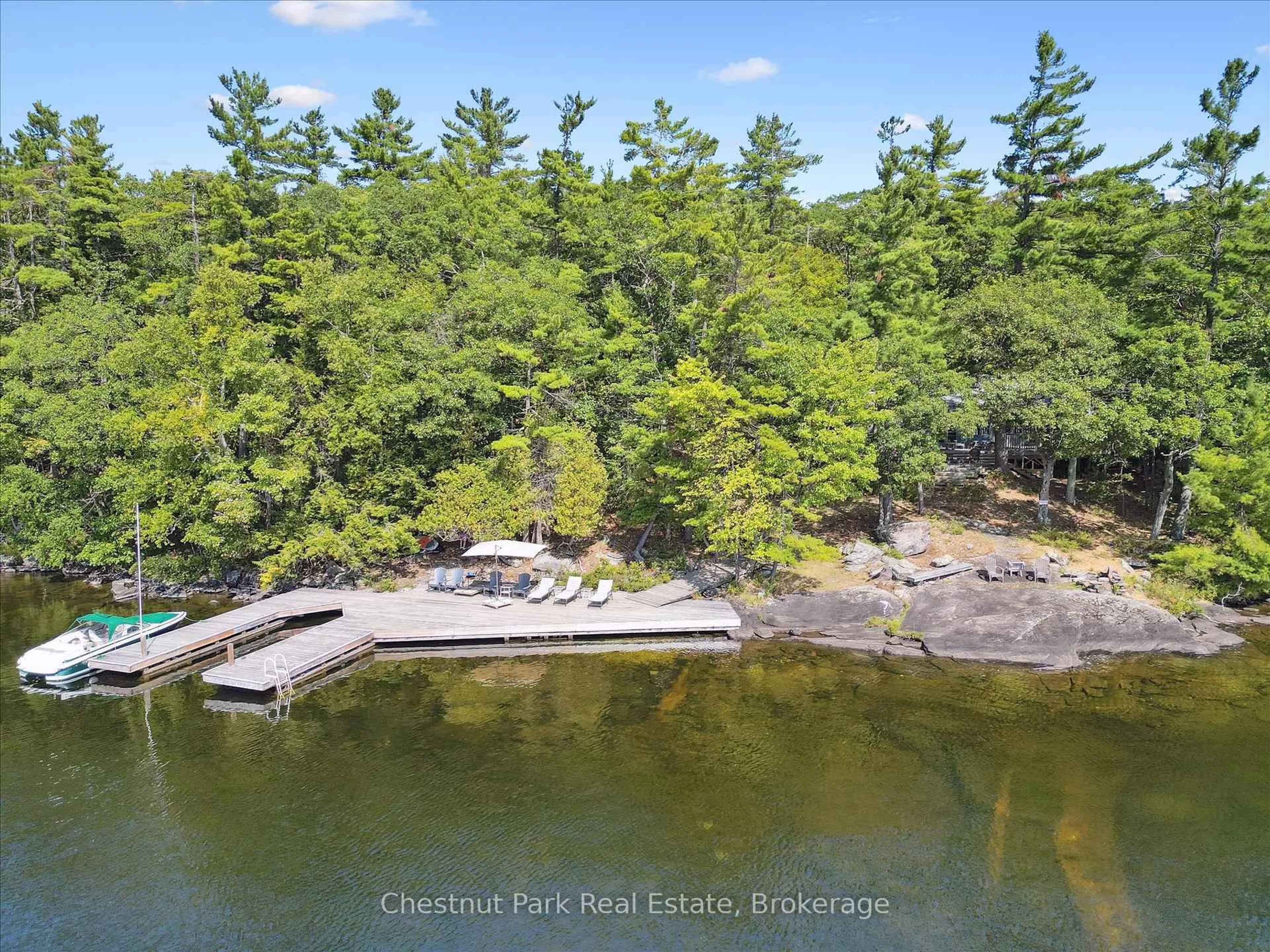 A pic from outside/outdoor area/front of a property/back of a property/a pic from drone, water/lake/river/ocean view for 982 Browning Island, Bracebridge Ontario P1L 1X2