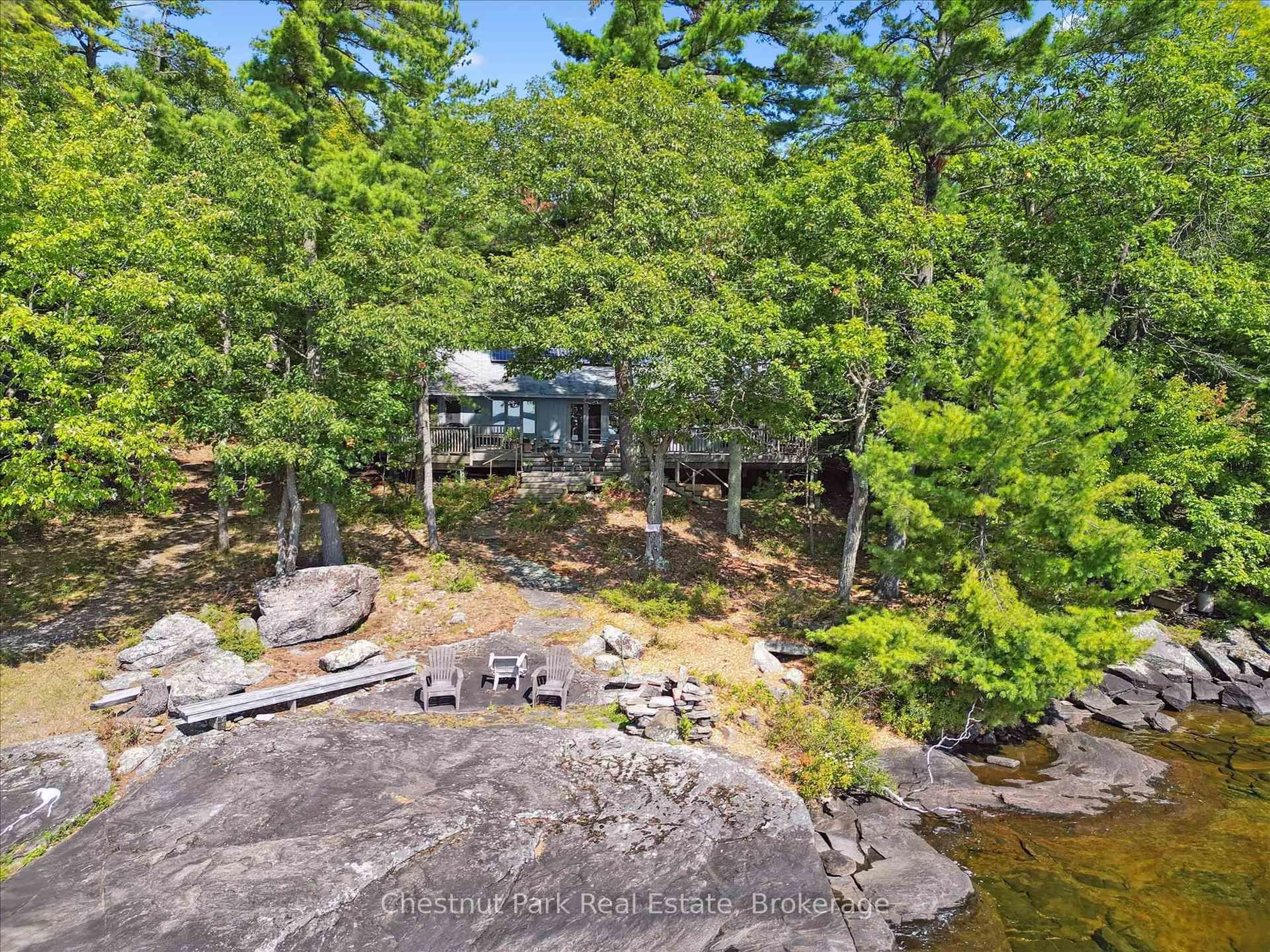 A pic from outside/outdoor area/front of a property/back of a property/a pic from drone, water/lake/river/ocean view for 982 Browning Island, Bracebridge Ontario P1L 1X2