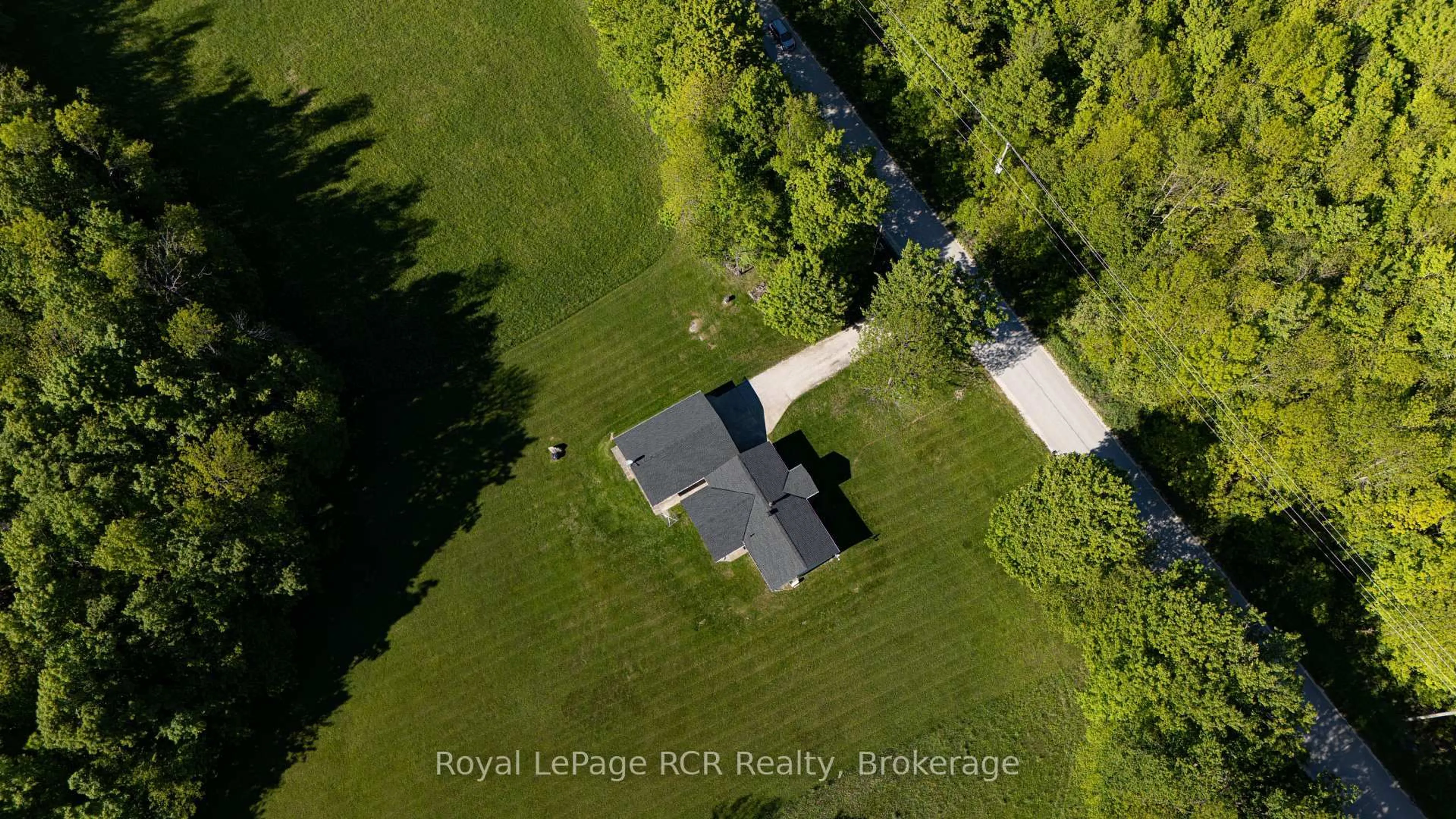 A pic from outside/outdoor area/front of a property/back of a property/a pic from drone, unknown for 310420 Kemble Rock Rd, Georgian Bluffs Ontario N0H 2T0
