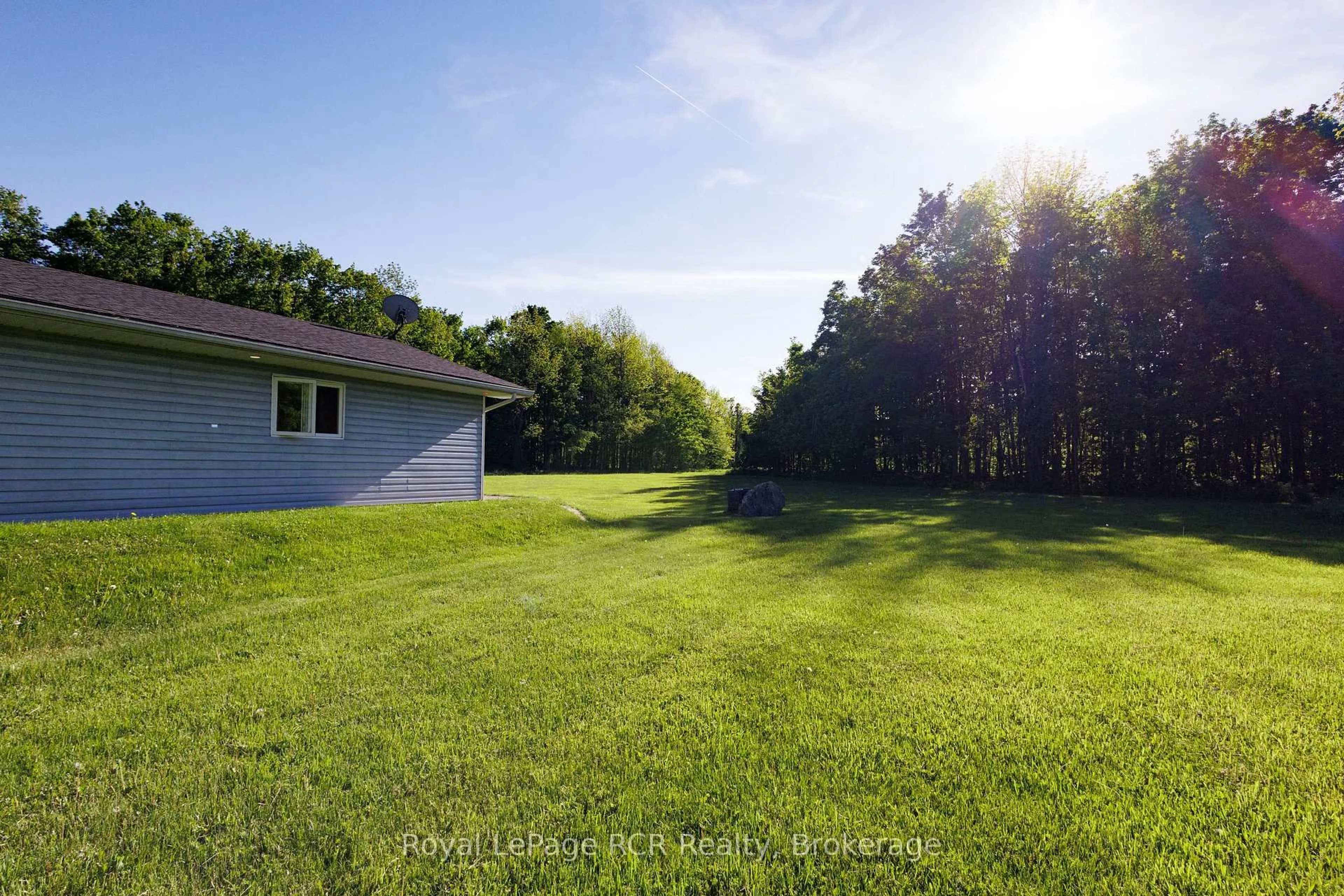 A pic from outside/outdoor area/front of a property/back of a property/a pic from drone, unknown for 310420 Kemble Rock Rd, Georgian Bluffs Ontario N0H 2T0