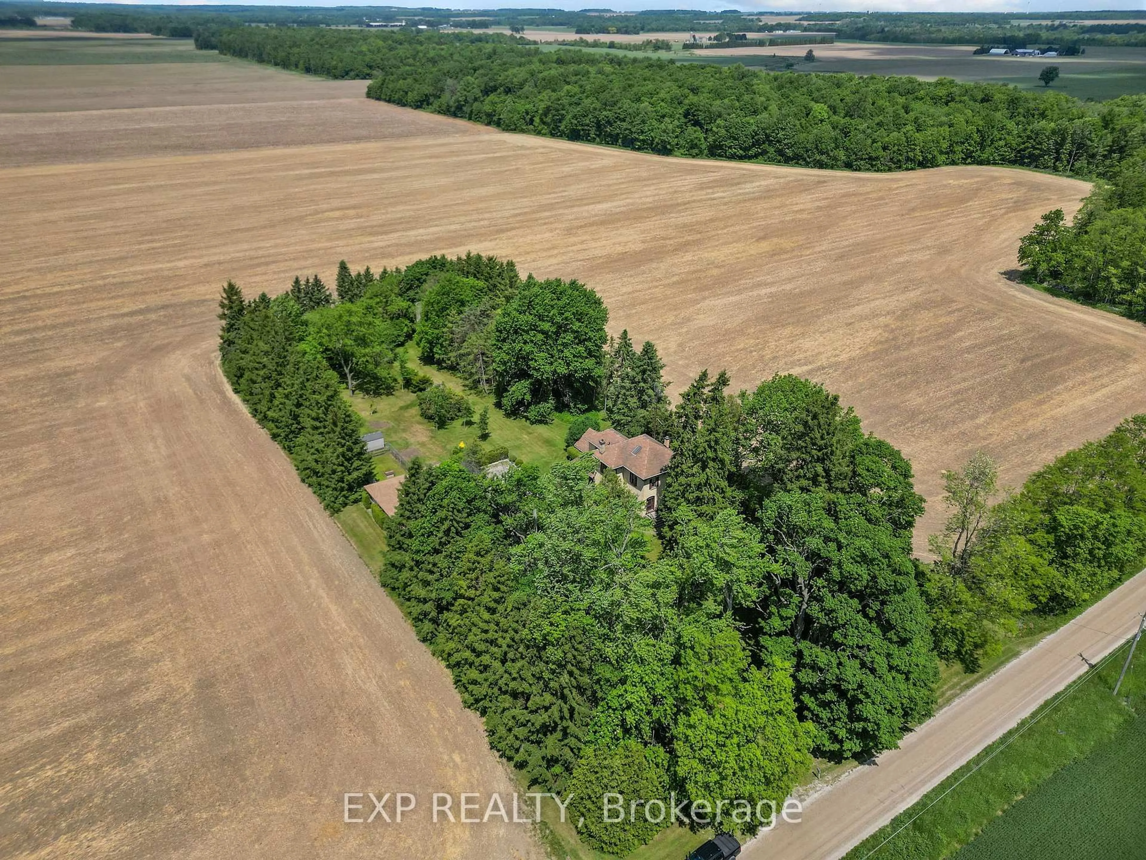 A pic from outside/outdoor area/front of a property/back of a property/a pic from drone, forest/trees view for 30569 Wyatt Rd, North Middlesex Ontario N7G 3H7