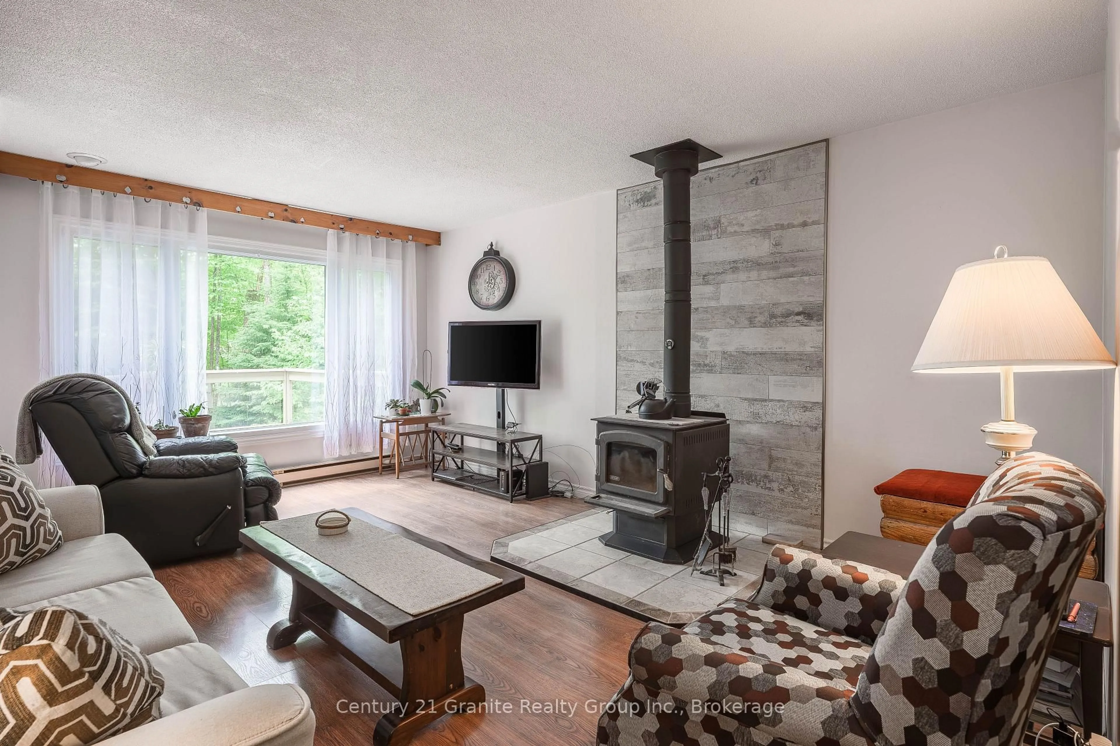 Living room with furniture, wood/laminate floor for 267 Riverside Dr, Dysart et al Ontario K0M 1S0