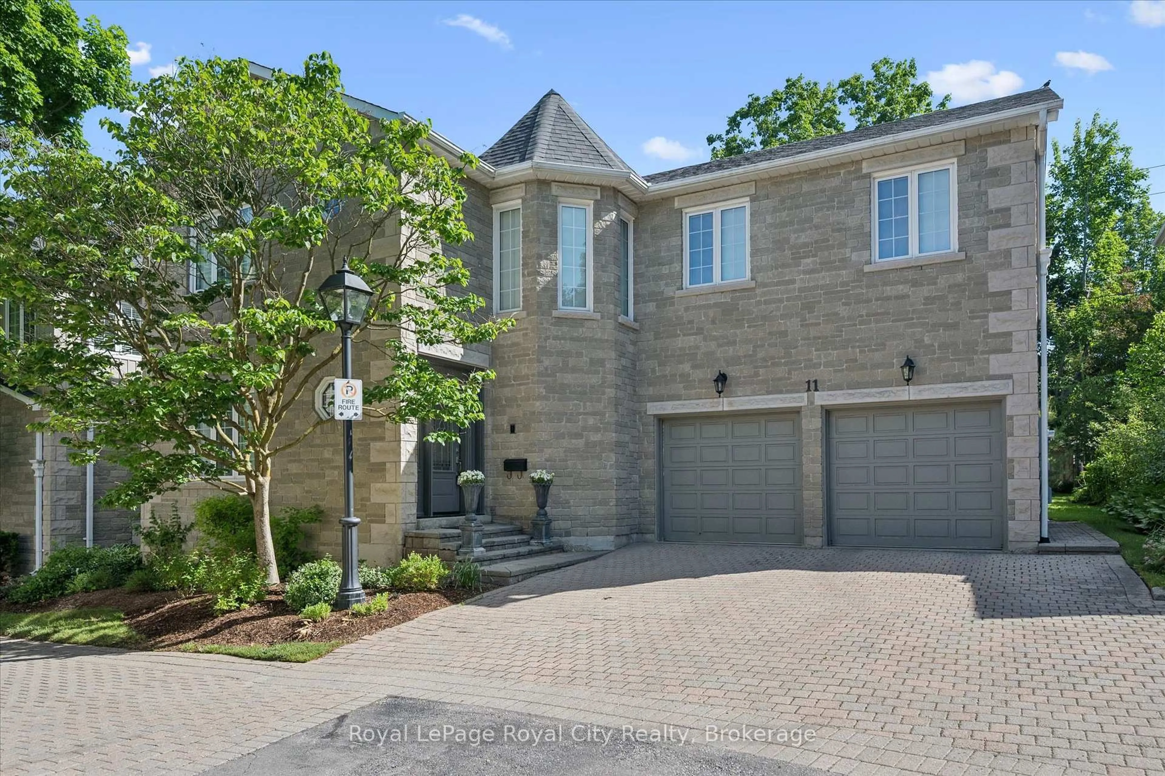 Home with brick exterior material, street for 25 MANOR PARK Cres #11, Guelph Ontario N1G 1A2