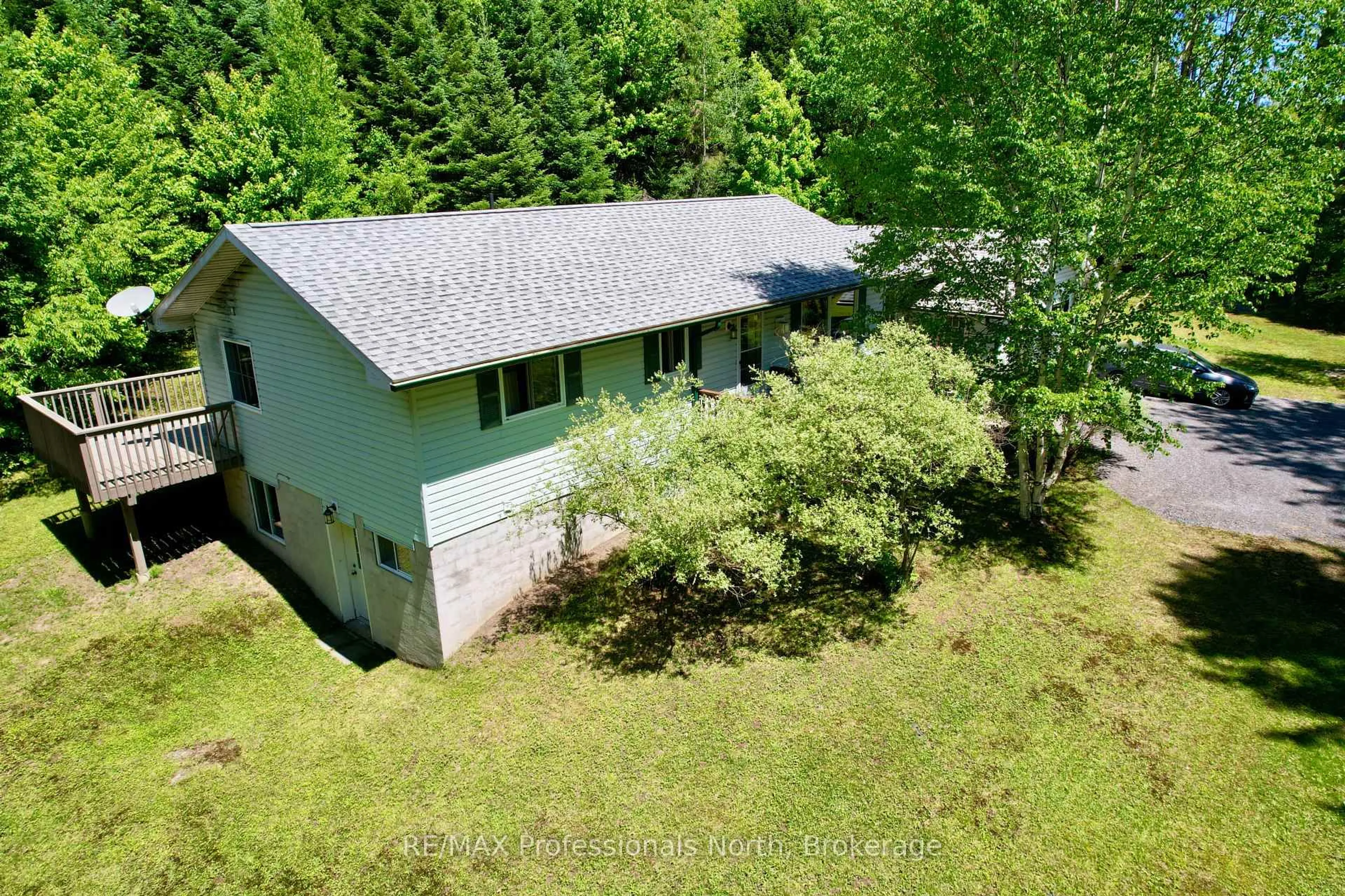 A pic from outside/outdoor area/front of a property/back of a property/a pic from drone, forest/trees view for 86 Bottings Rd, Huntsville Ontario P0B 1M0