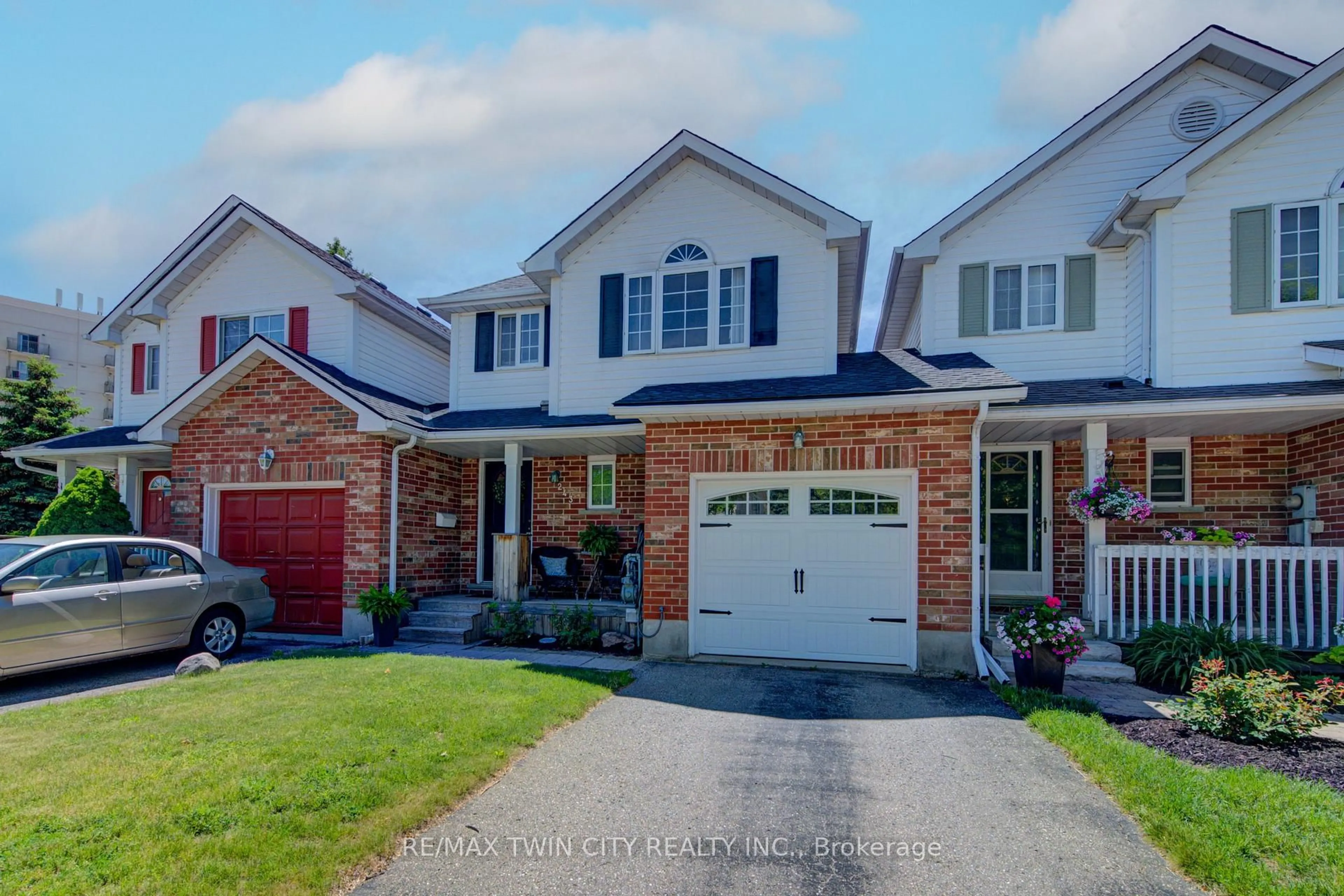 Home with brick exterior material, street for 243 Auburn Dr, Waterloo Ontario N2K 3X7
