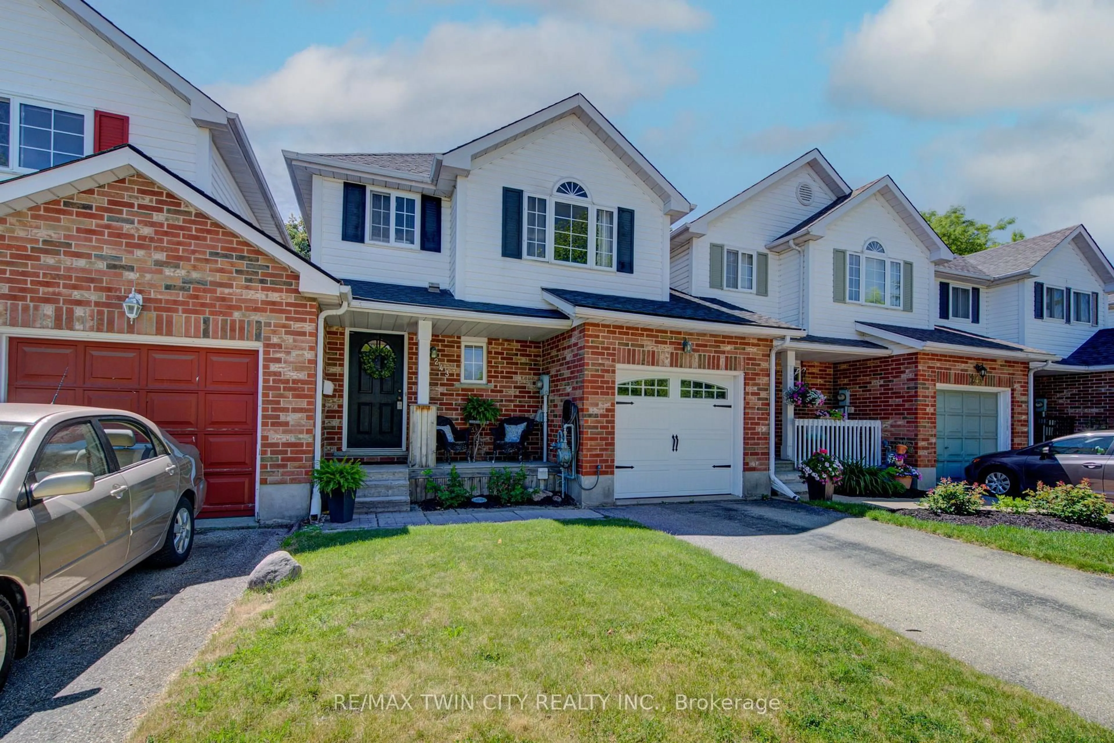 Home with brick exterior material, street for 243 Auburn Dr, Waterloo Ontario N2K 3X7
