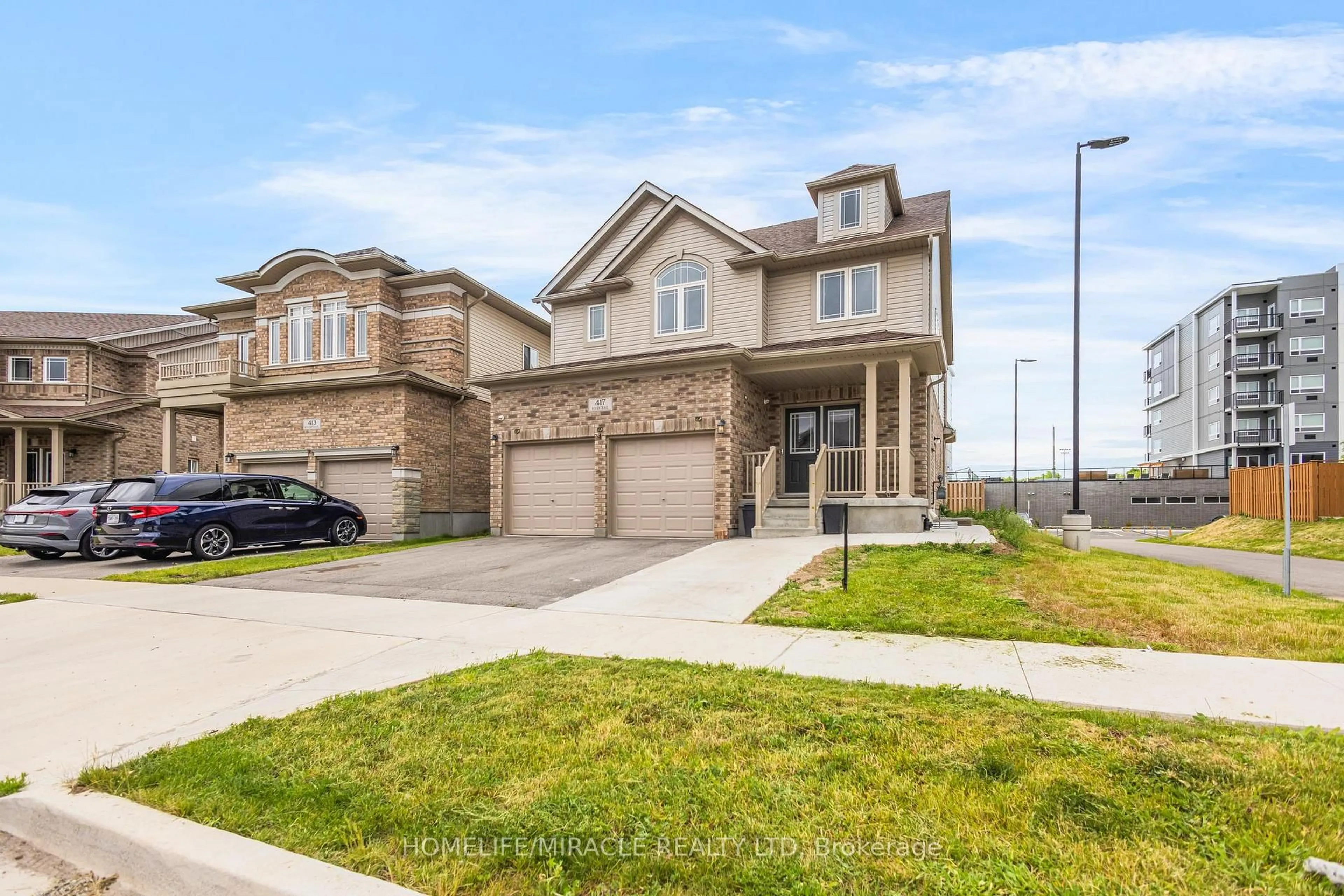Home with brick exterior material, street for 417 RIVERTRAIL Ave, Kitchener Ontario N2A 0K2