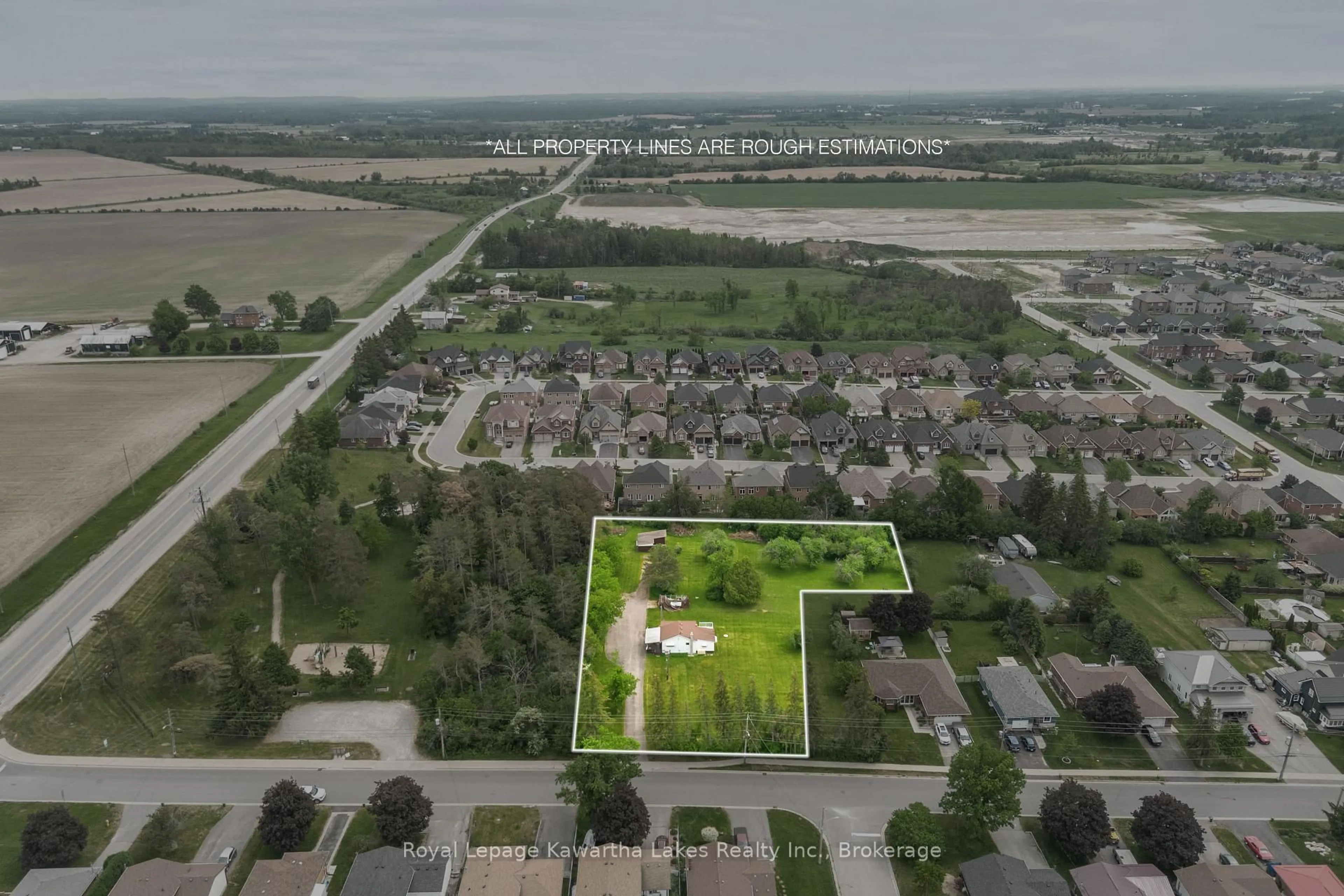 A pic from outside/outdoor area/front of a property/back of a property/a pic from drone, street for 55 Parkside Dr, Kawartha Lakes Ontario K9V 5Y1