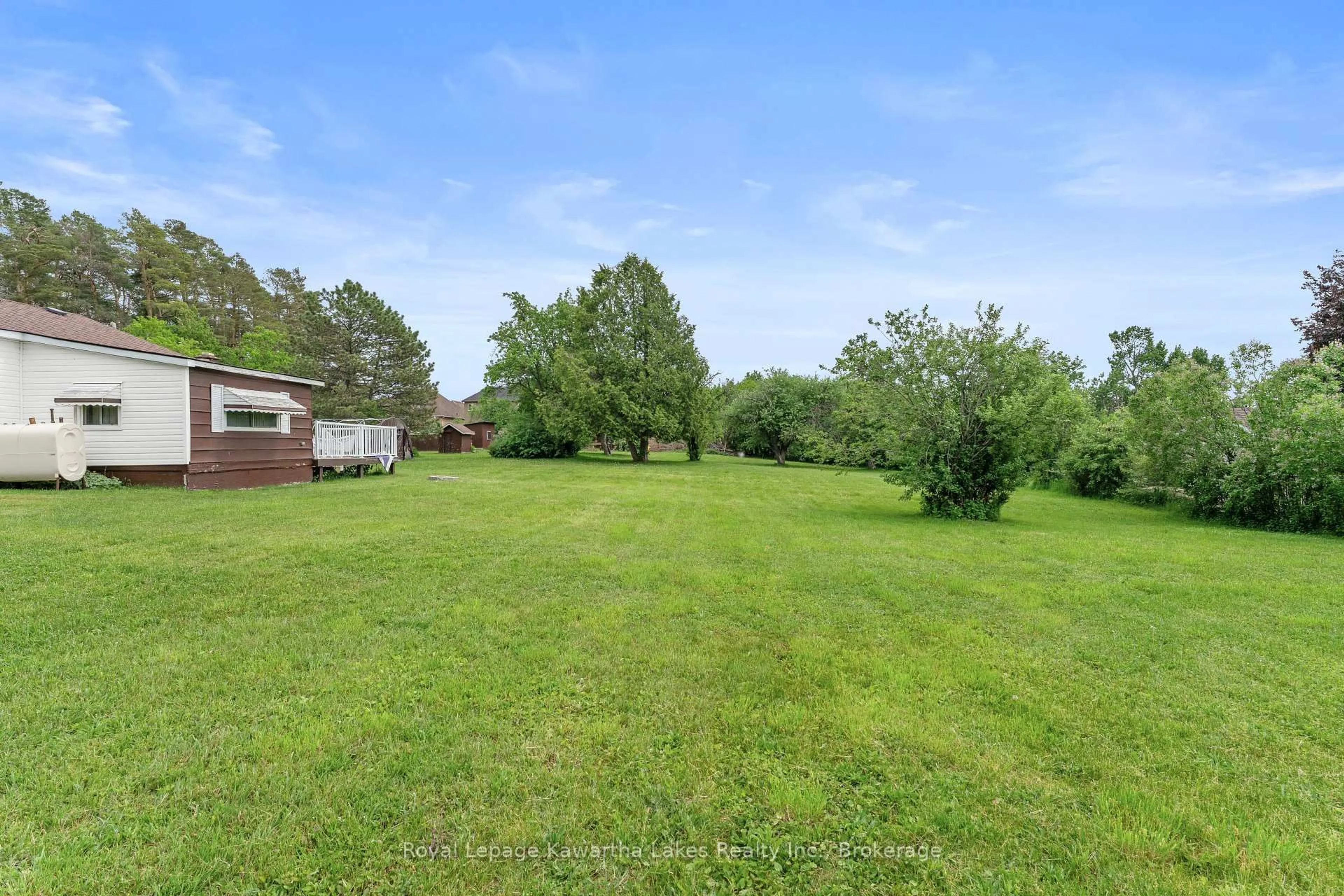 A pic from outside/outdoor area/front of a property/back of a property/a pic from drone, water/lake/river/ocean view for 55 Parkside Dr, Kawartha Lakes Ontario K9V 5Y1
