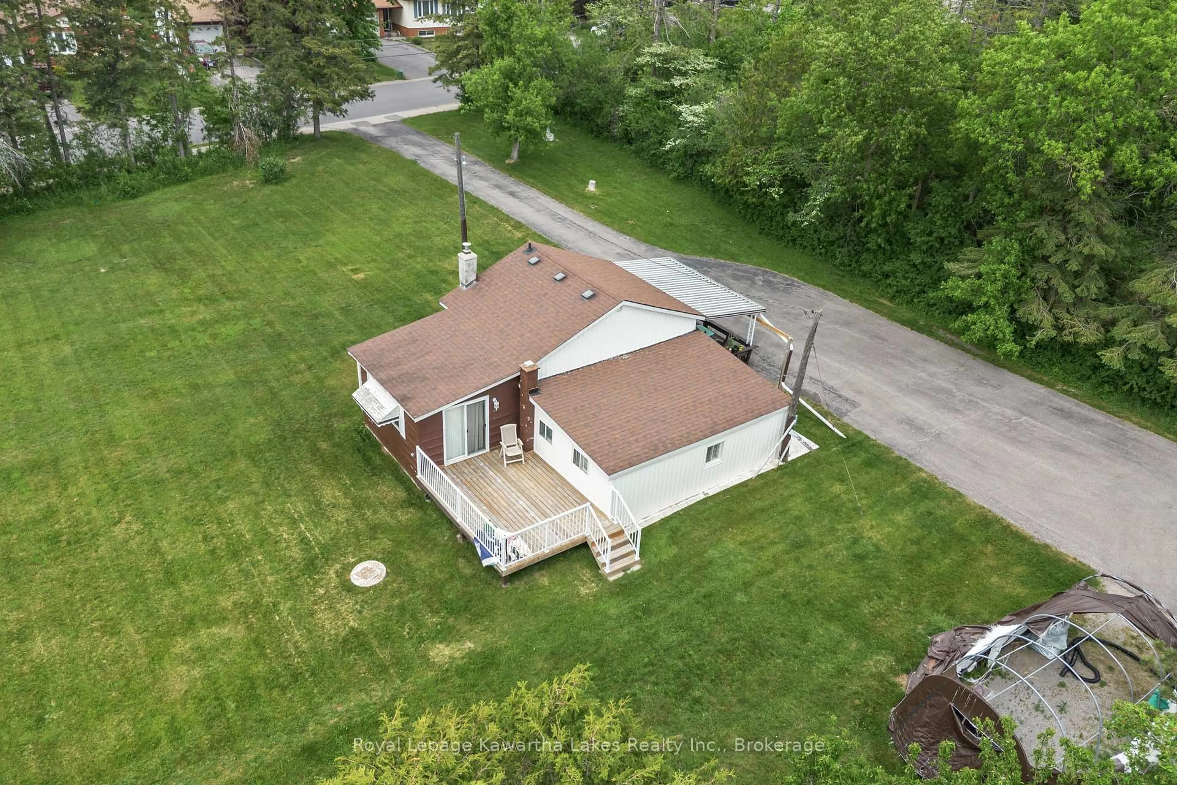 A pic from outside/outdoor area/front of a property/back of a property/a pic from drone, unknown for 55 Parkside Dr, Kawartha Lakes Ontario K9V 5Y1