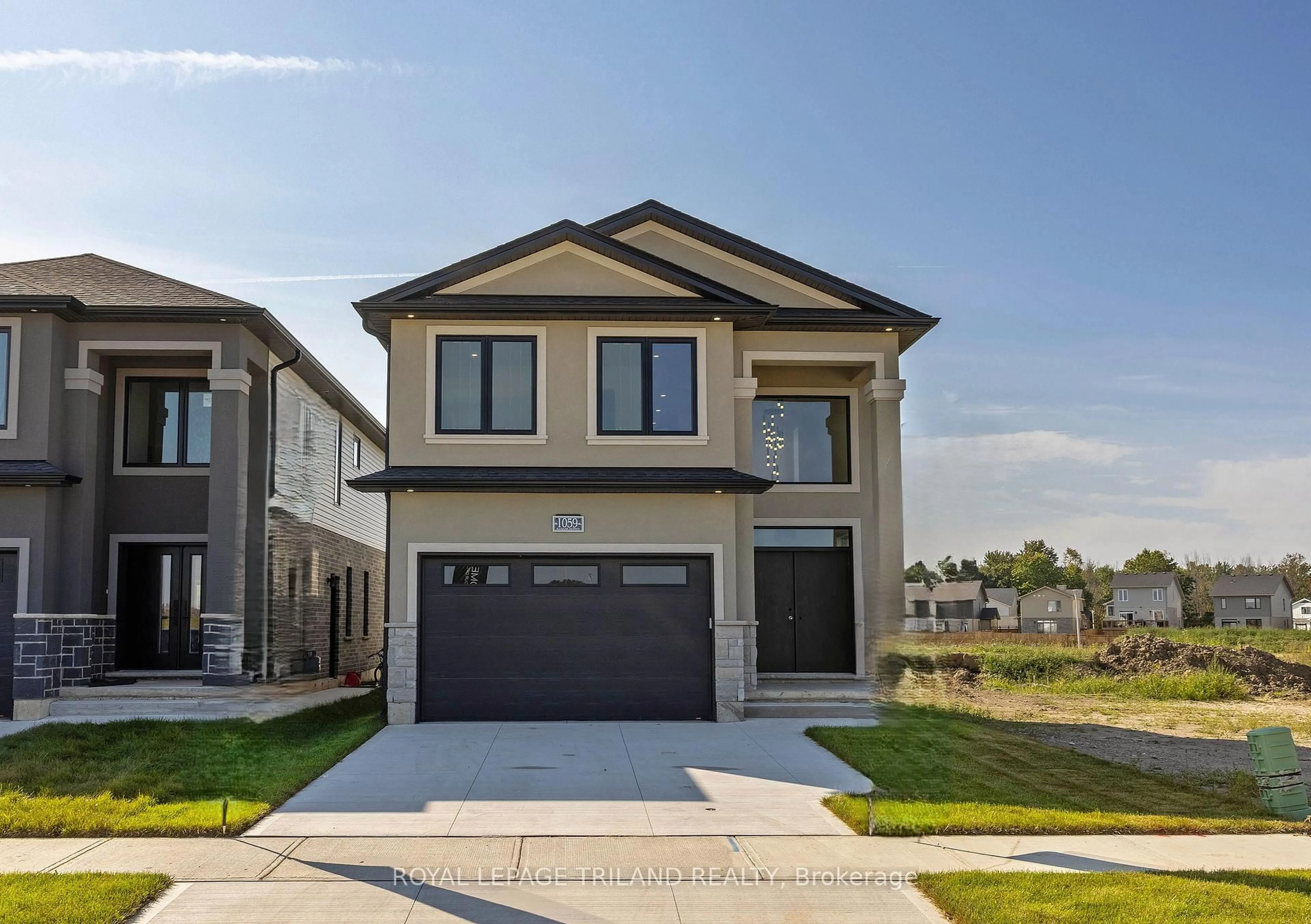Home with vinyl exterior material, street for 1045 Karenana Rd, London South Ontario N6M 0K2