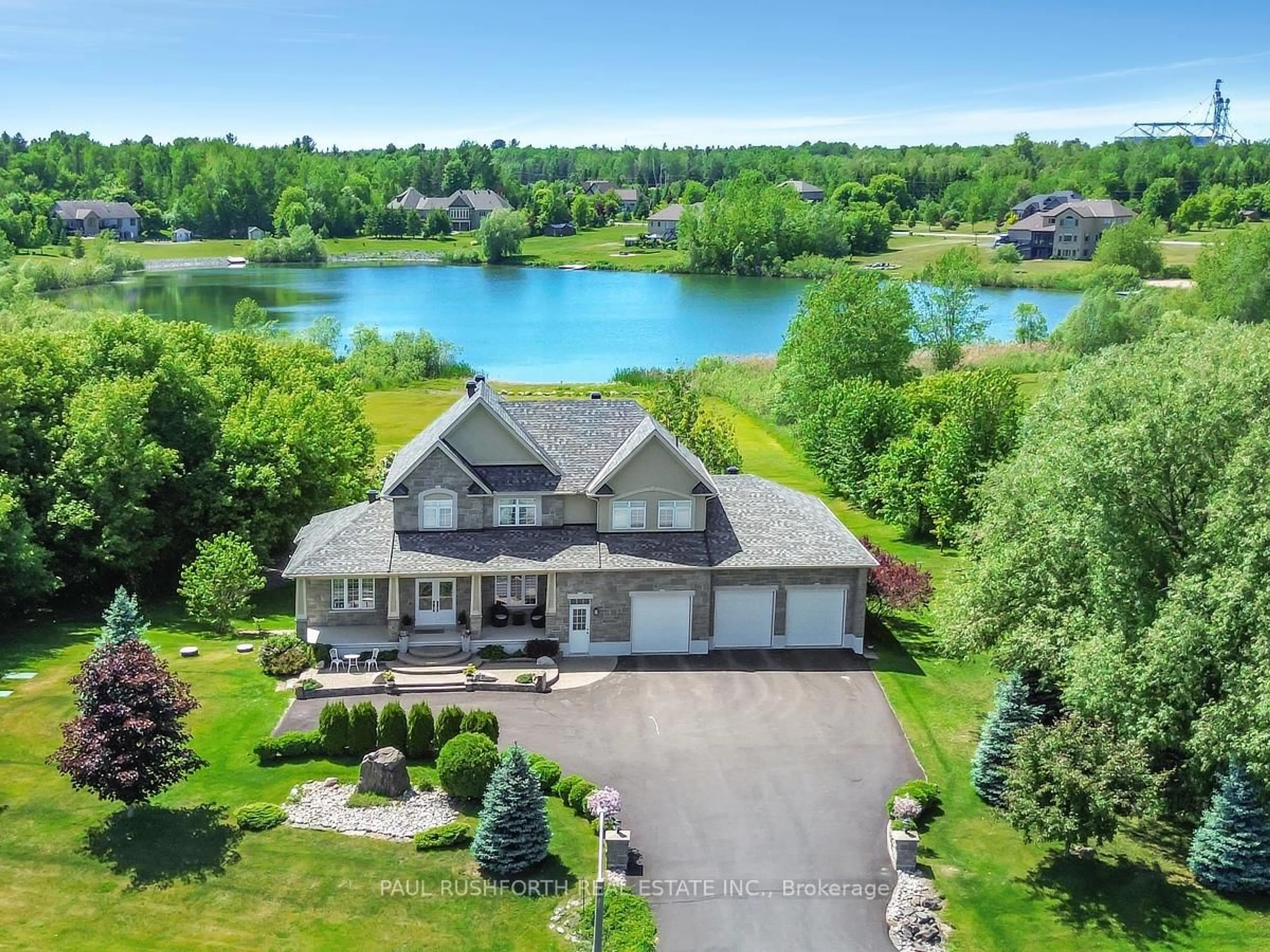 A pic from outside/outdoor area/front of a property/back of a property/a pic from drone, water/lake/river/ocean view for 365 West Lake Circ, Carp Ontario K0A 1L0