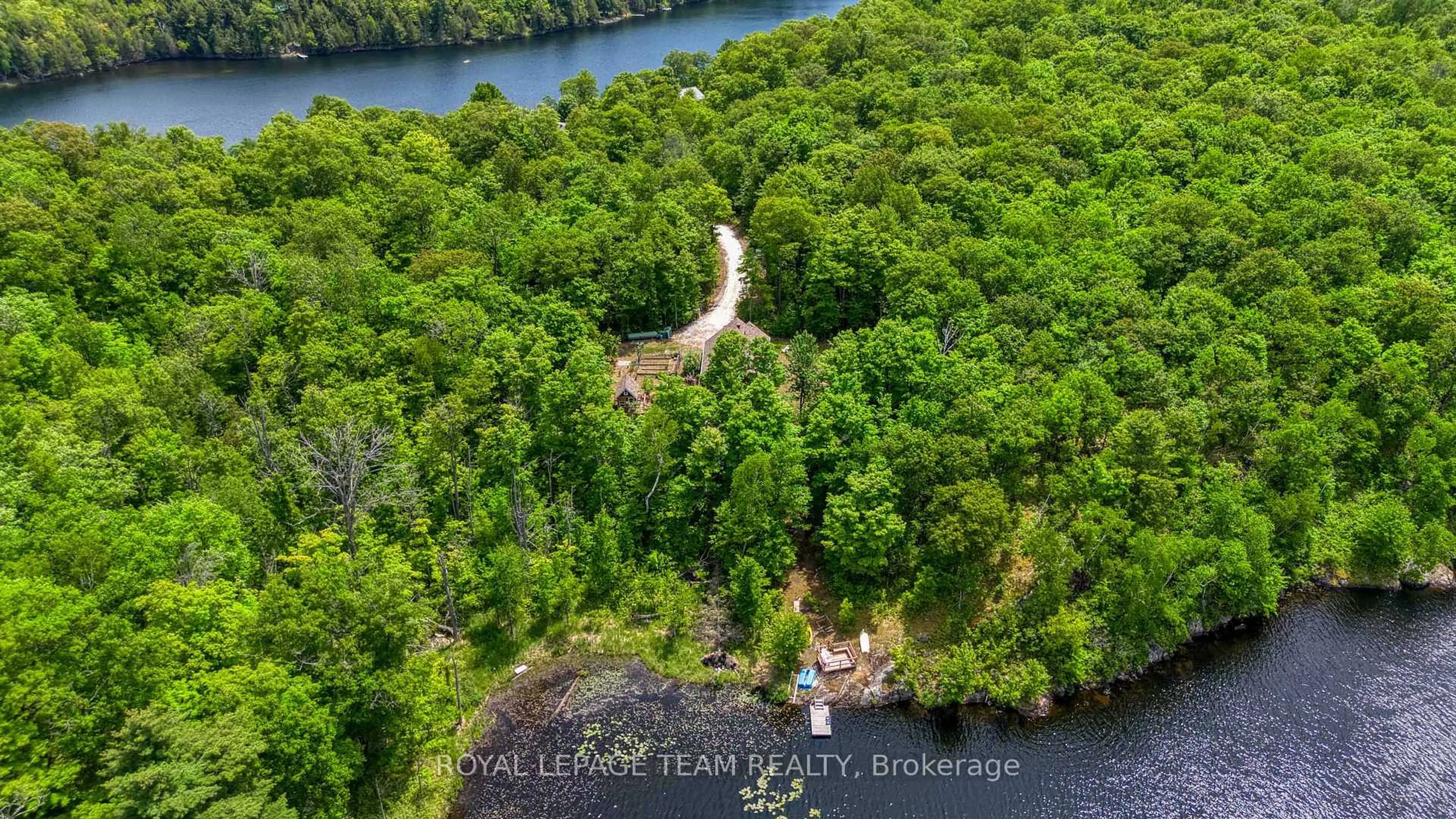 A pic from outside/outdoor area/front of a property/back of a property/a pic from drone, water/lake/river/ocean view for 196 Silvery Lane, Maberly Ontario K0H 2B0