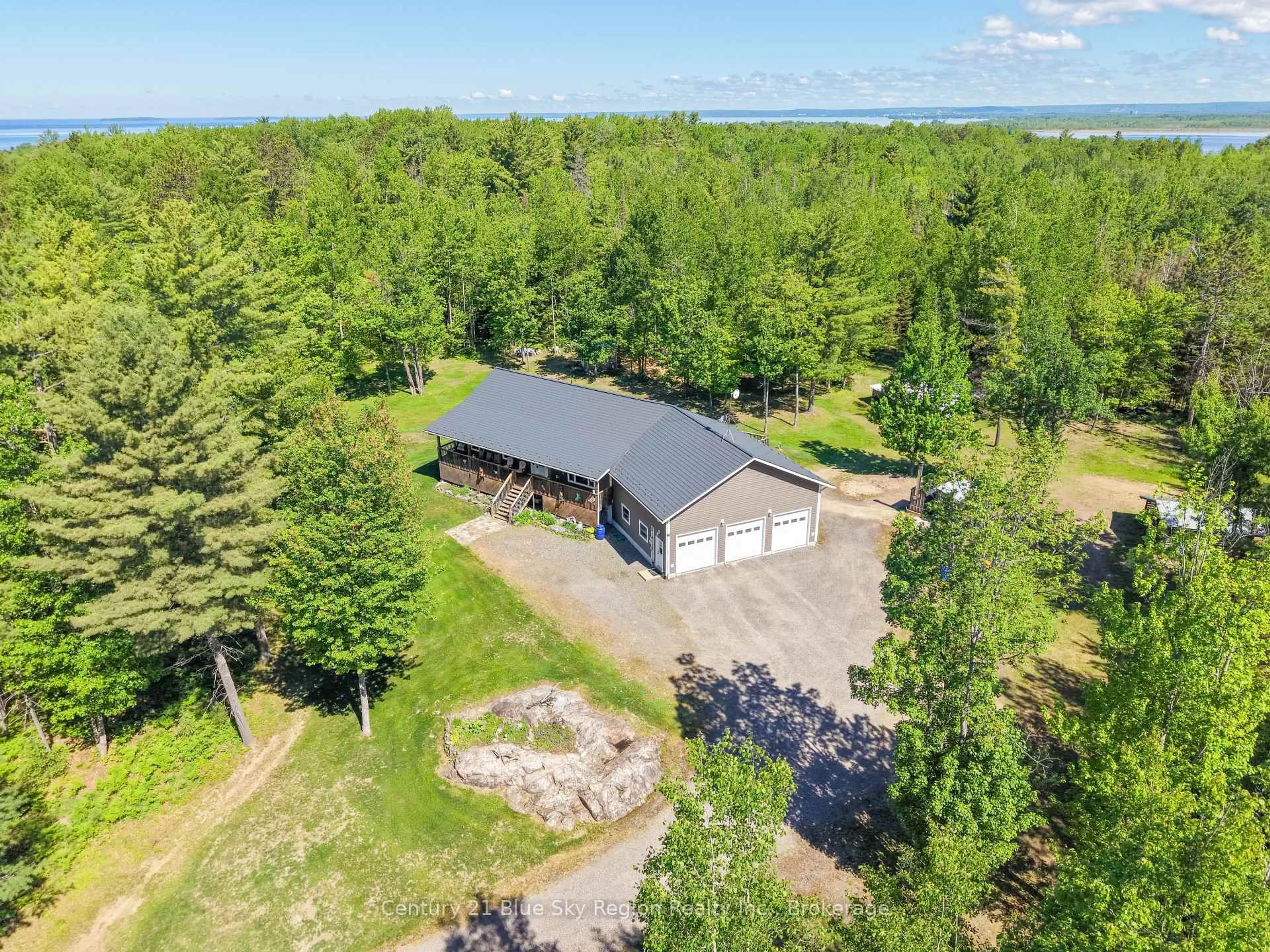 A pic from outside/outdoor area/front of a property/back of a property/a pic from drone, water/lake/river/ocean view for 106 Lighthouse Rd, Callander Ontario P0H 1H0