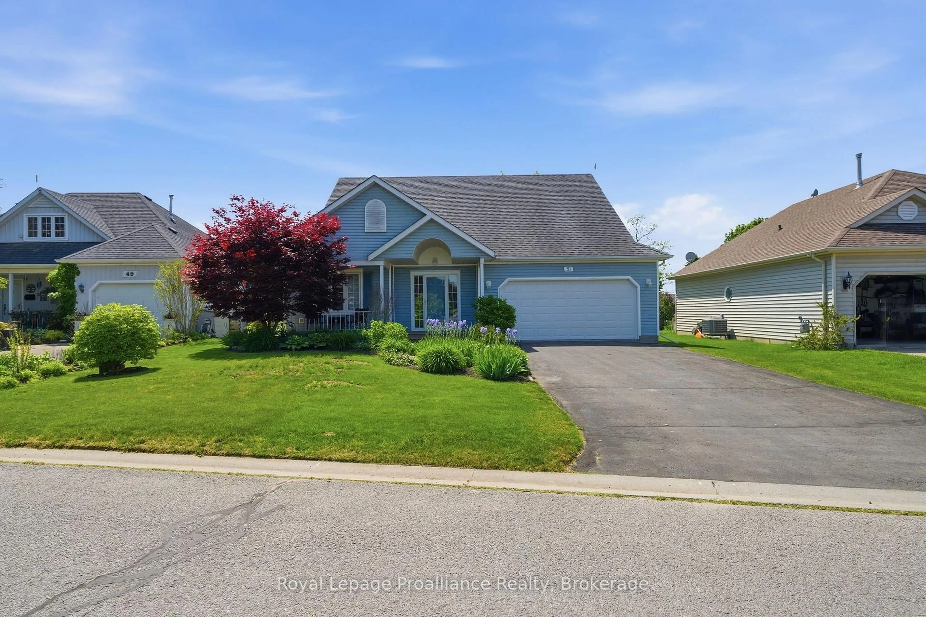 Home with vinyl exterior material, street for 51 Mills Rd, Brighton Ontario K0K 1H0