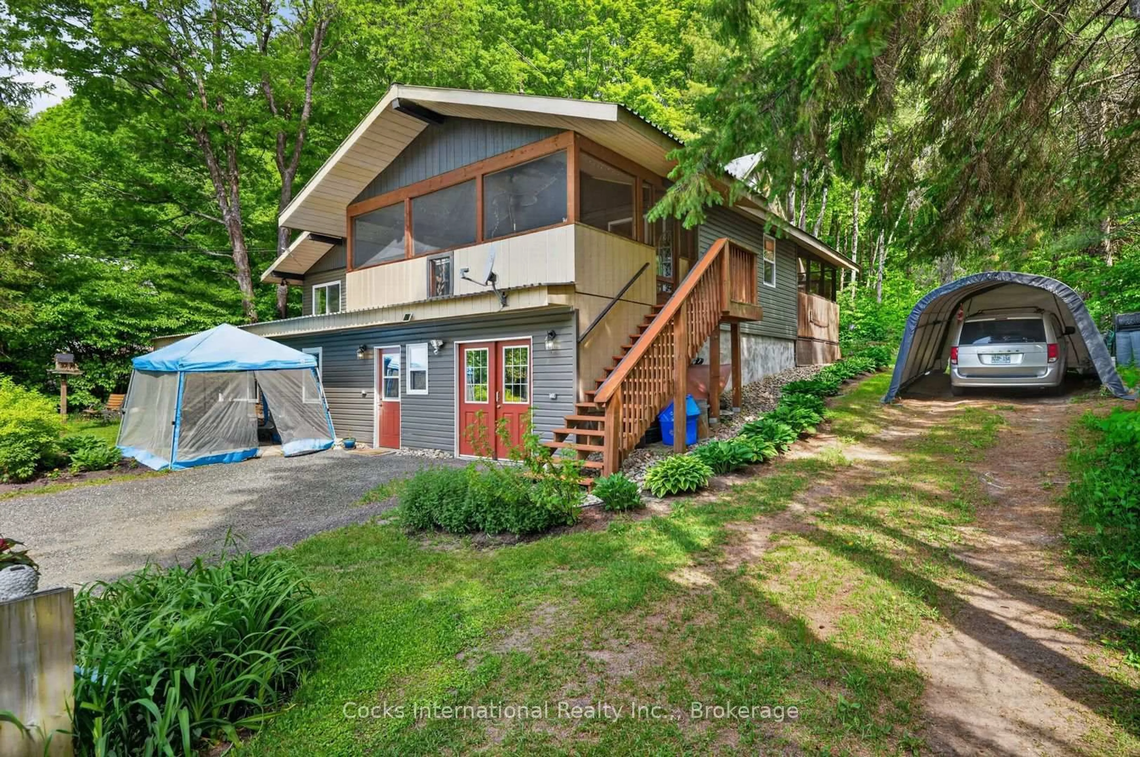 A pic from outside/outdoor area/front of a property/back of a property/a pic from drone, unknown for 306 Highway 141 Highway, Huntsville Ontario P0B 1M0