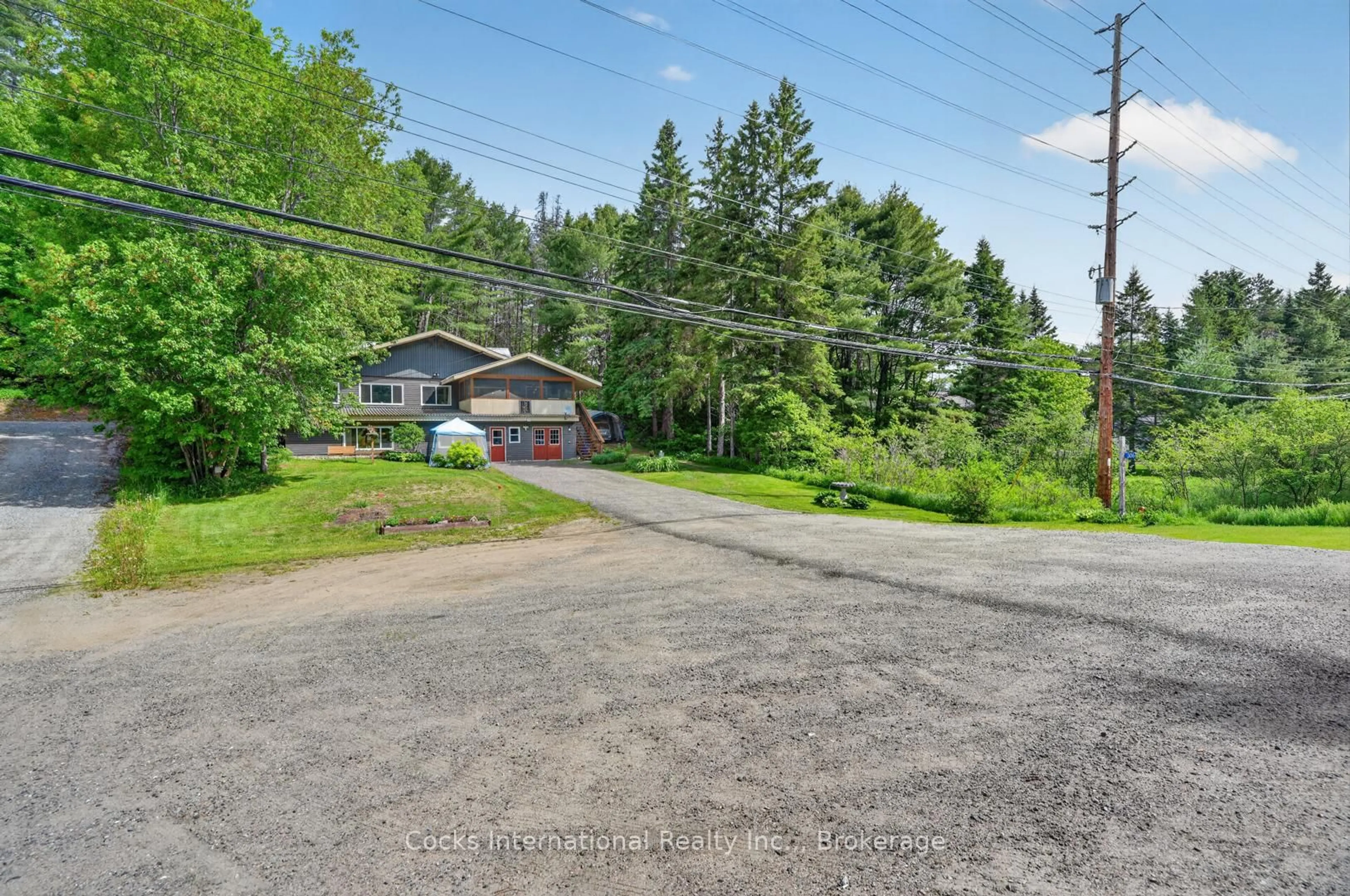 A pic from outside/outdoor area/front of a property/back of a property/a pic from drone, street for 306 Highway 141 Highway, Huntsville Ontario P0B 1M0