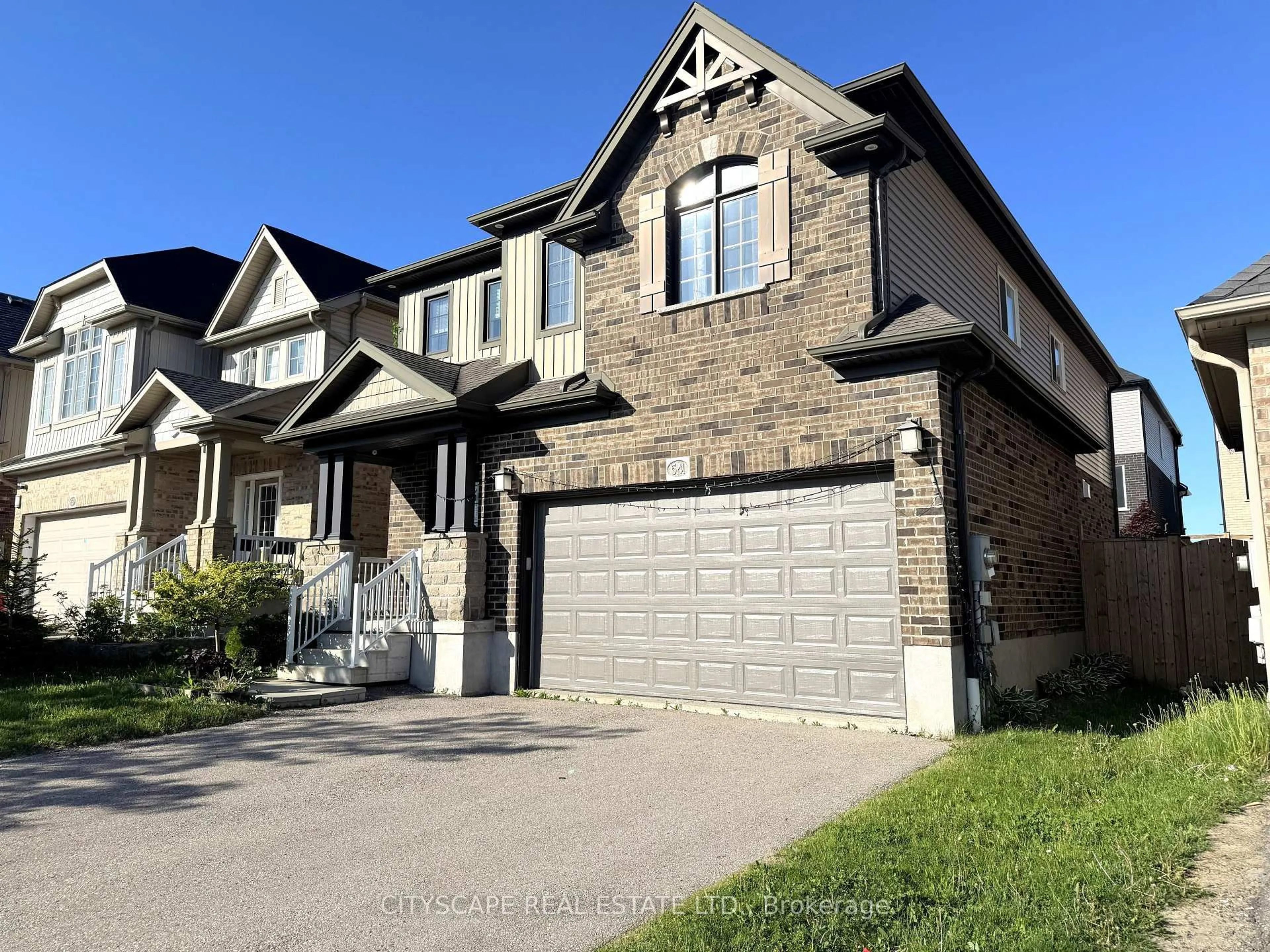 Home with brick exterior material, street for 541 Sundew Dr, Kitchener Ontario N2V 0B8