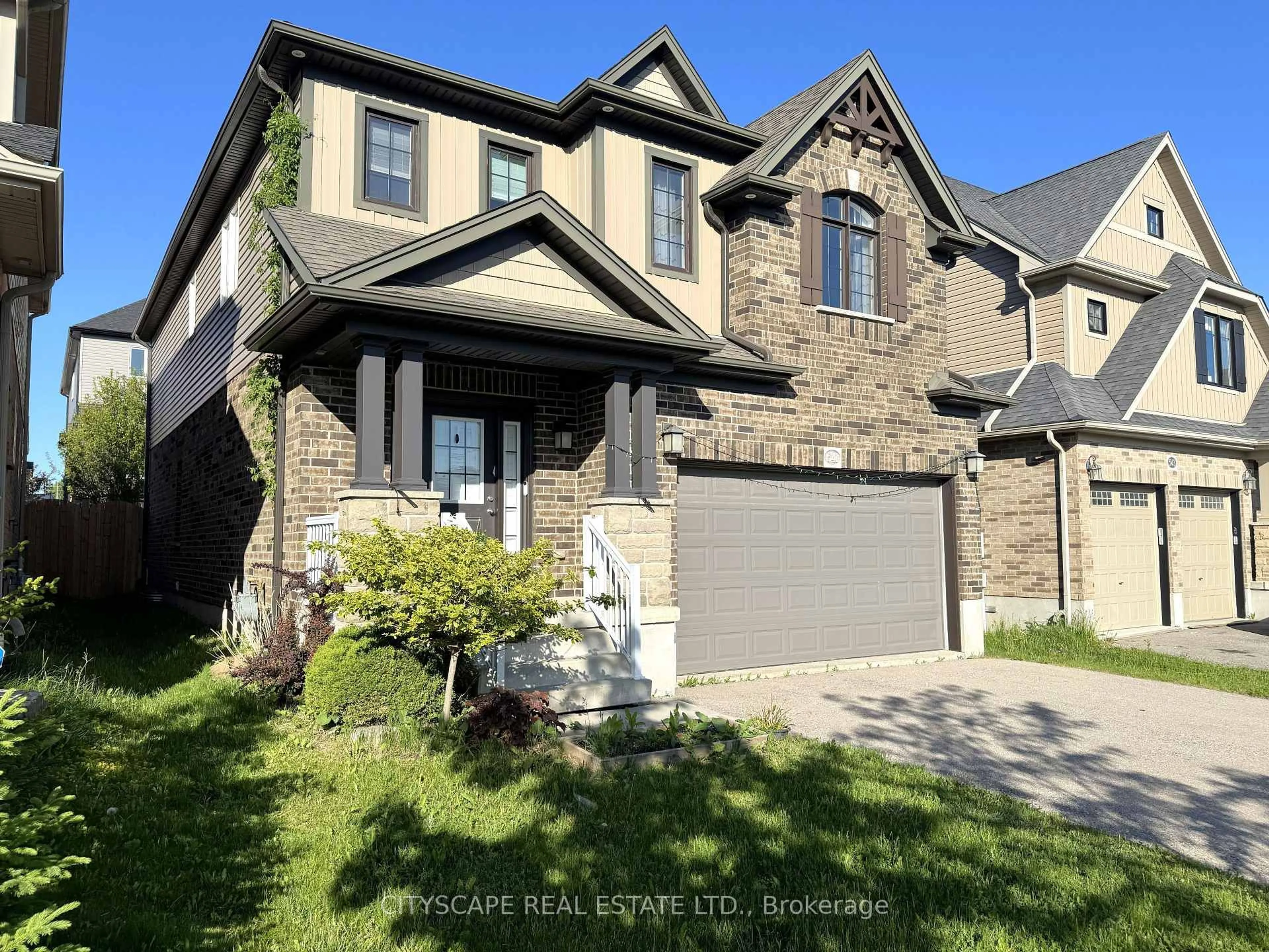 Home with brick exterior material, street for 541 Sundew Dr, Kitchener Ontario N2V 0B8