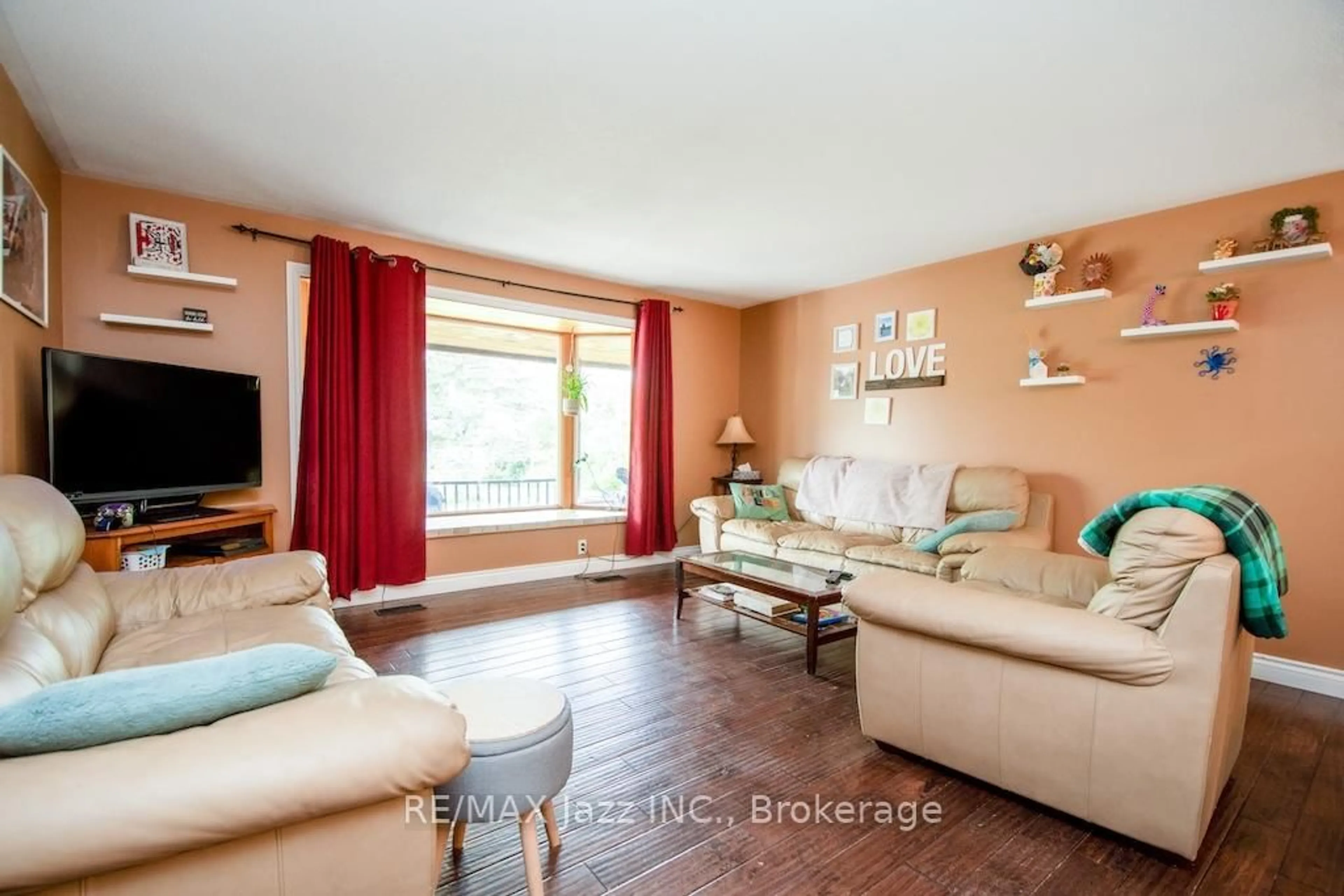 Living room with furniture, wood/laminate floor for 270 Clifford Rd, Douro-Dummer Ontario K0L 3A0