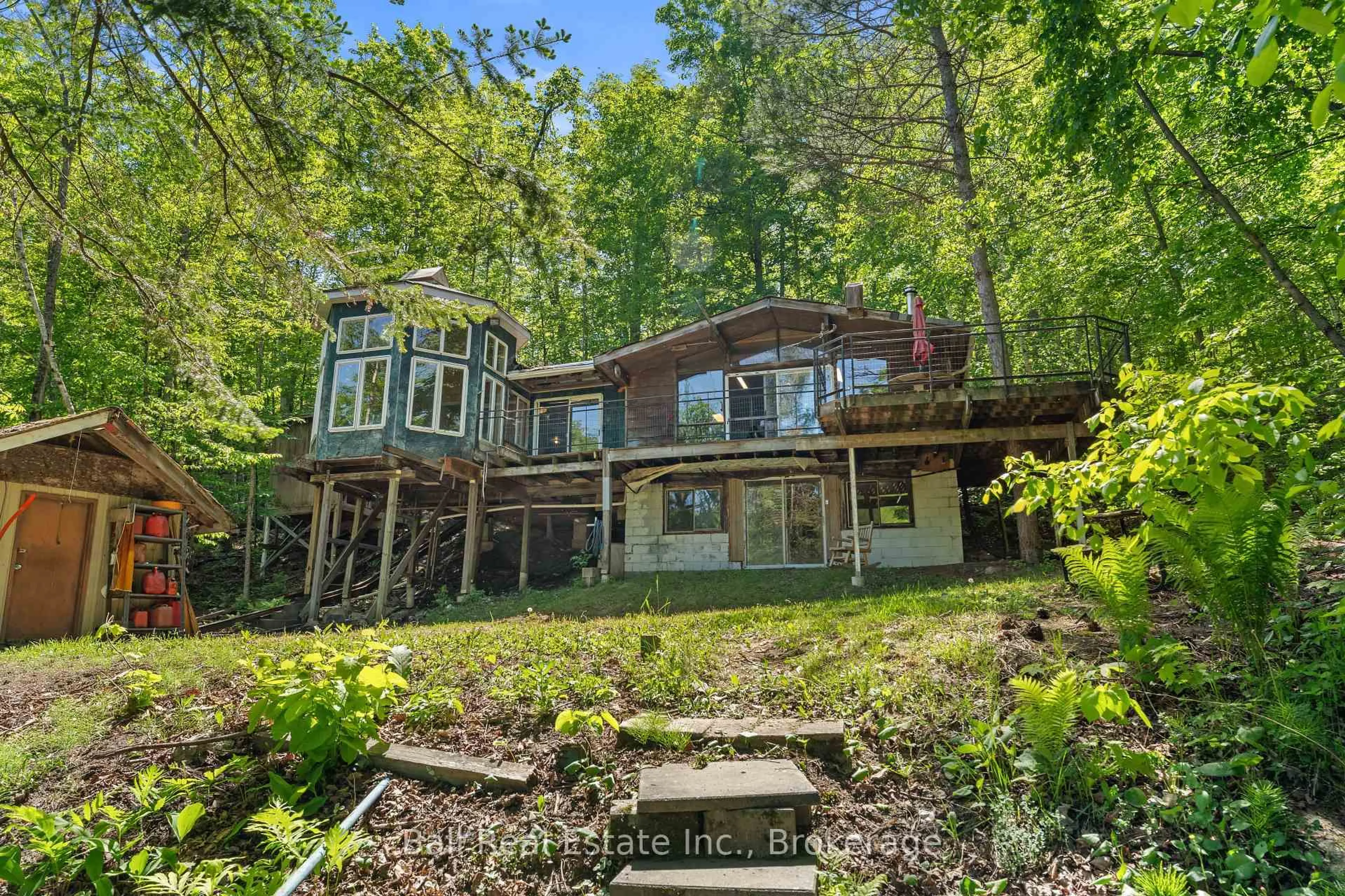 A pic from outside/outdoor area/front of a property/back of a property/a pic from drone, water/lake/river/ocean view for 1021 Spencer's Tr, Highlands East Ontario K0M 2A1