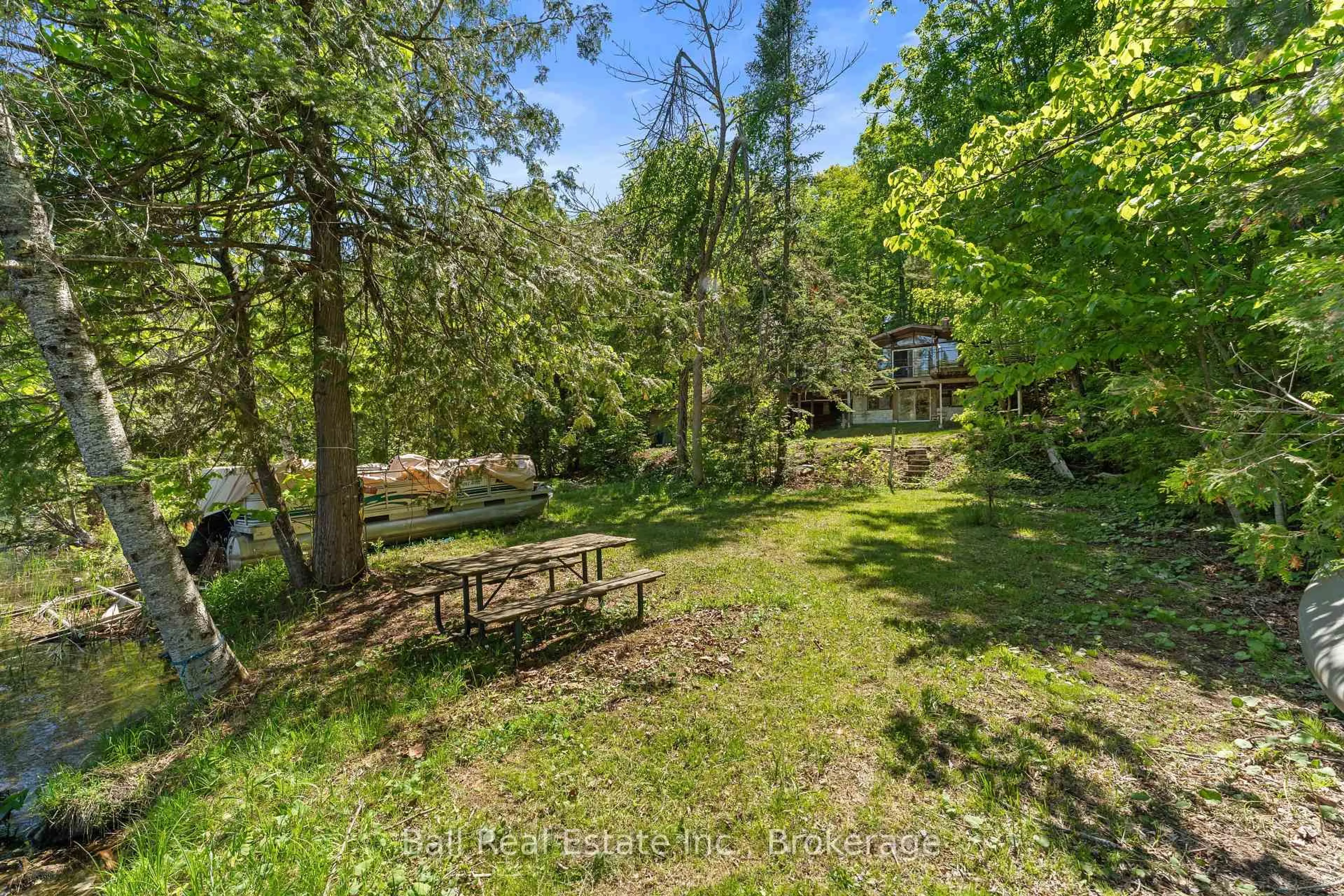 A pic from outside/outdoor area/front of a property/back of a property/a pic from drone, forest/trees view for 1021 Spencer's Tr, Highlands East Ontario K0M 2A1