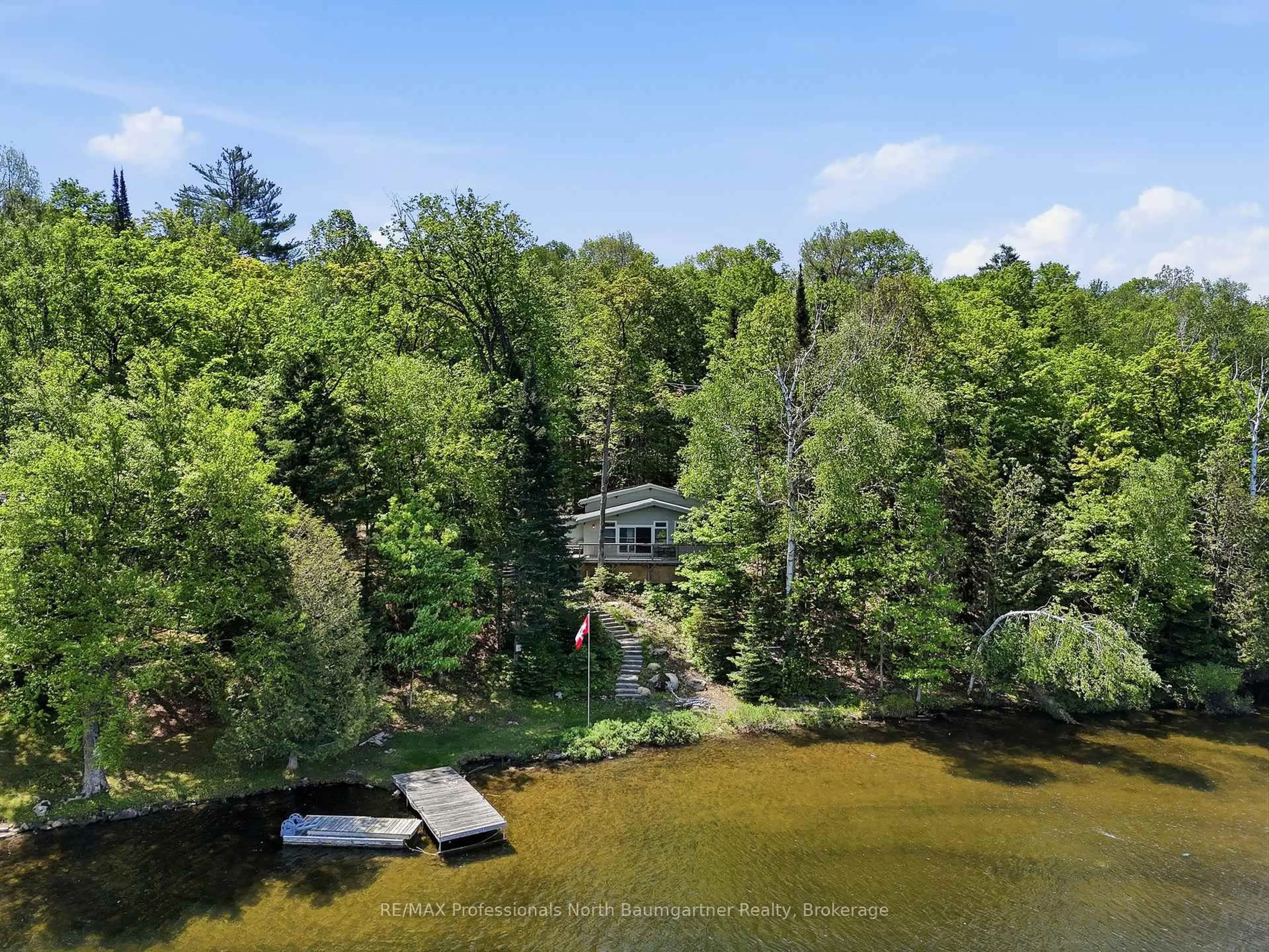 A pic from outside/outdoor area/front of a property/back of a property/a pic from drone, water/lake/river/ocean view for 1021 Colonization Tr, Dysart et al Ontario K0M 1S0