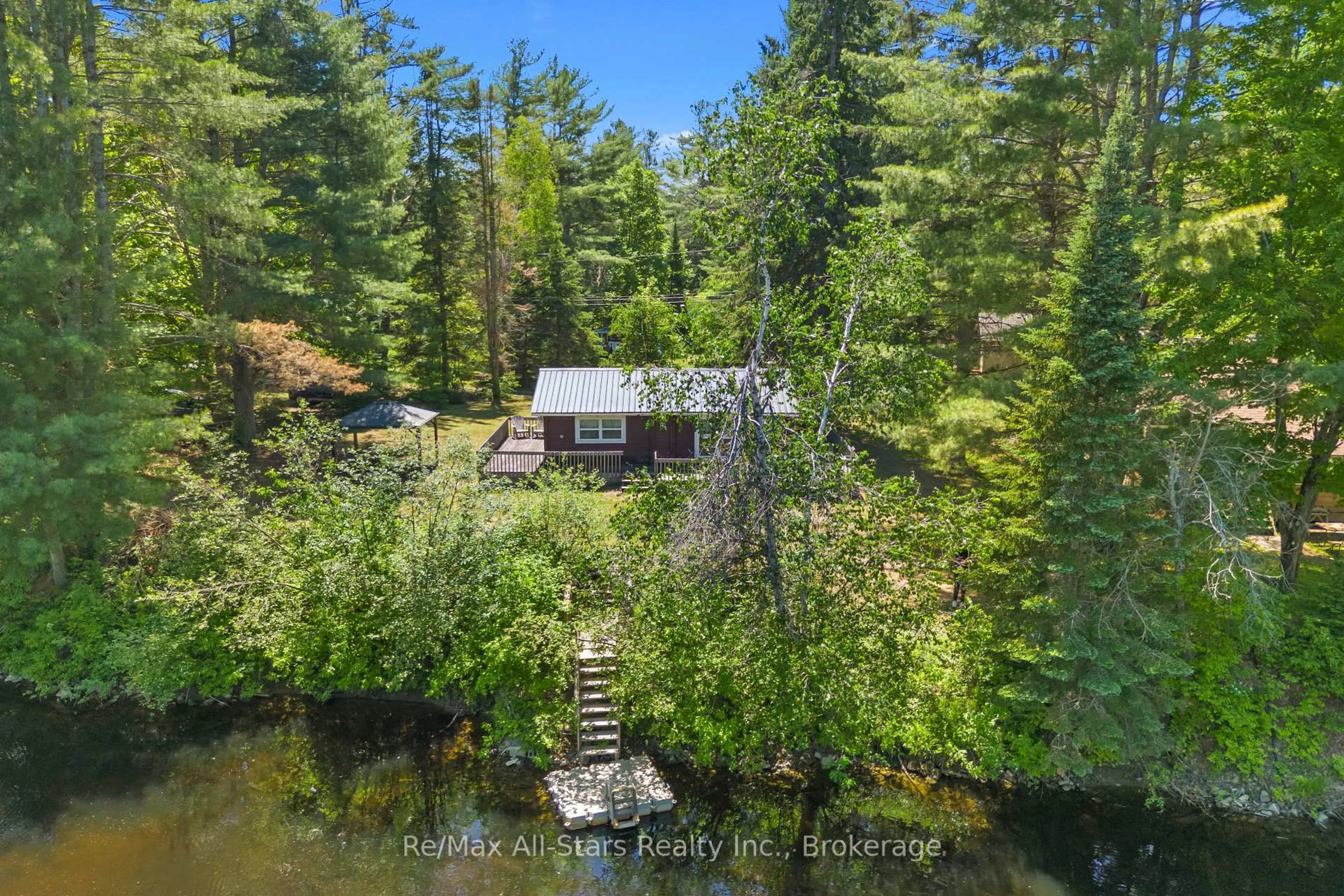 A pic from outside/outdoor area/front of a property/back of a property/a pic from drone, water/lake/river/ocean view for 1042 Goadsby Tr, Minden Hills Ontario K0M 2A0