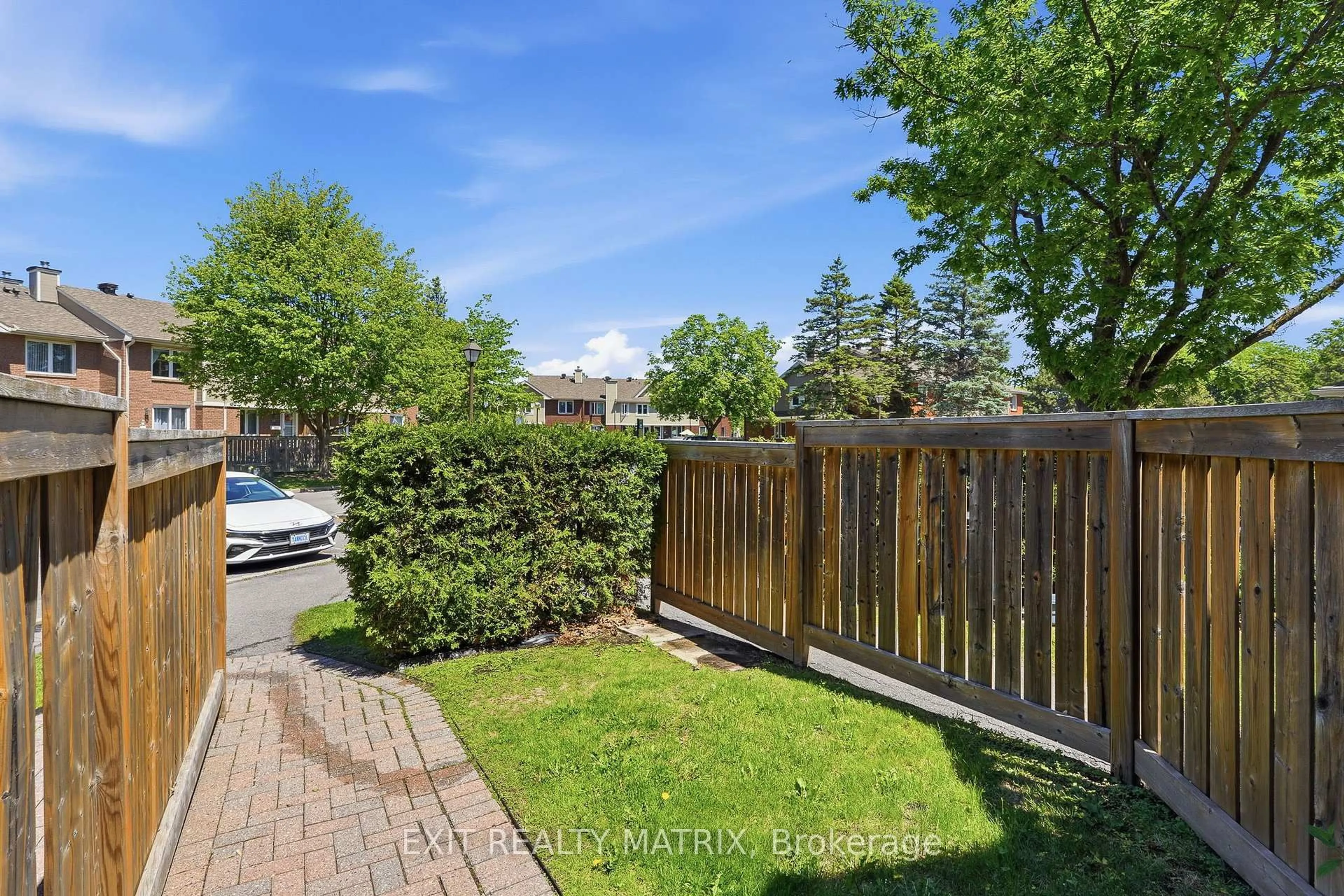 A pic from outside/outdoor area/front of a property/back of a property/a pic from drone, street for 495 Canteval Terr #205, Orleans Ontario K4A 2E1