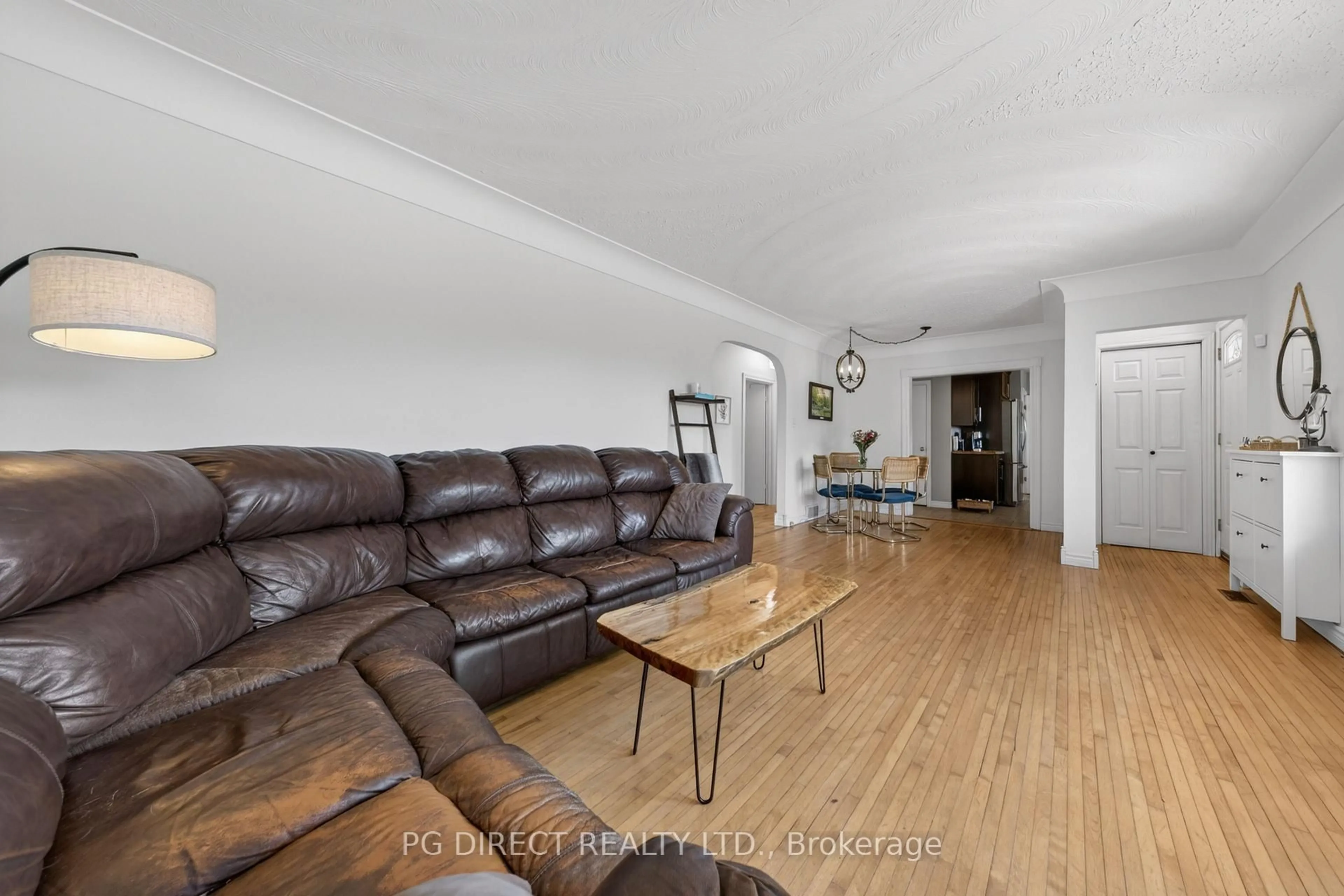 Living room with furniture, wood/laminate floor for 140 Blake Ave, Sault Ste Marie Ontario P6B 4Y1