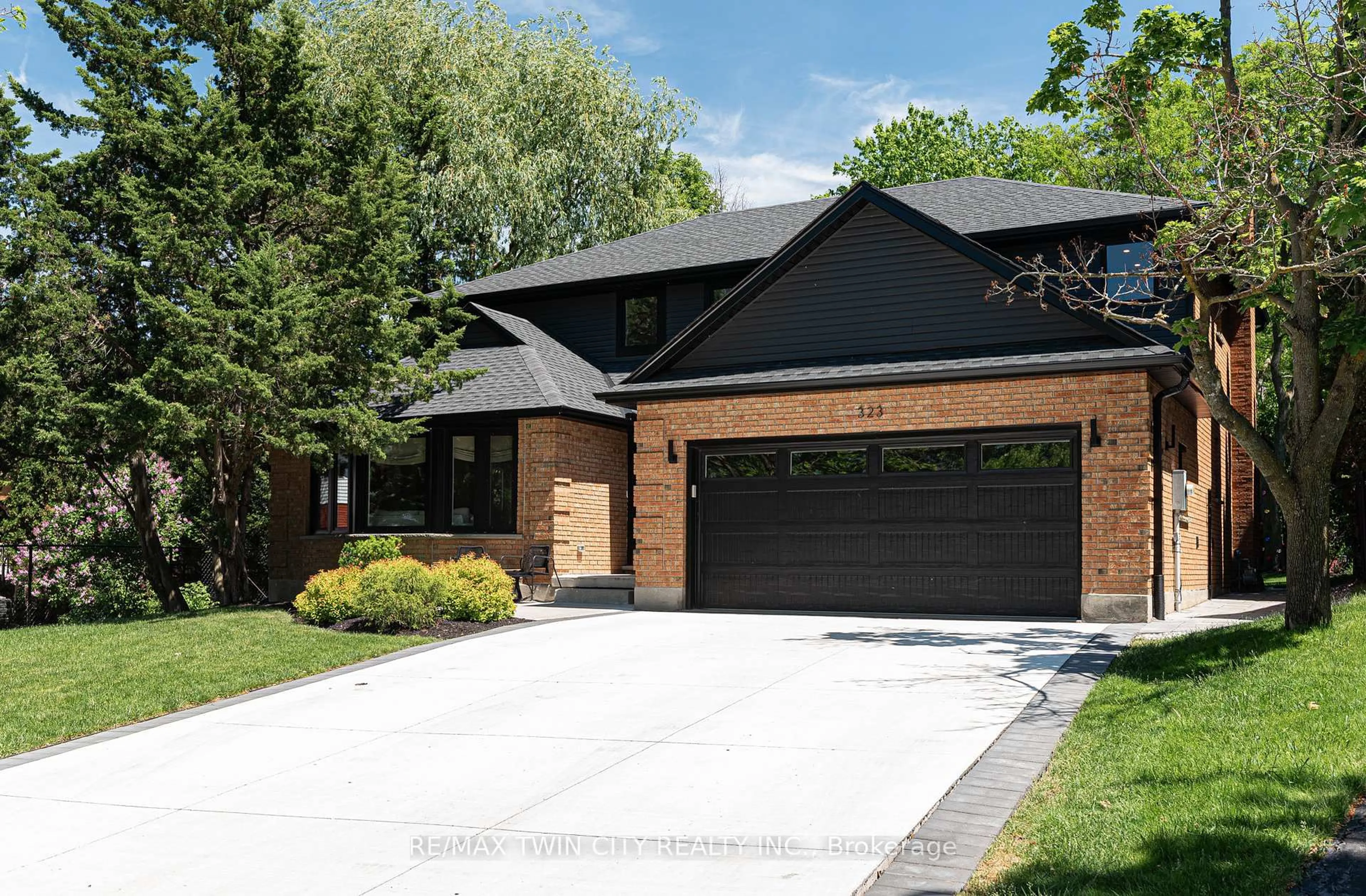 Home with brick exterior material, street for 323 Calvington Pl, Waterloo Ontario N2T 1P9