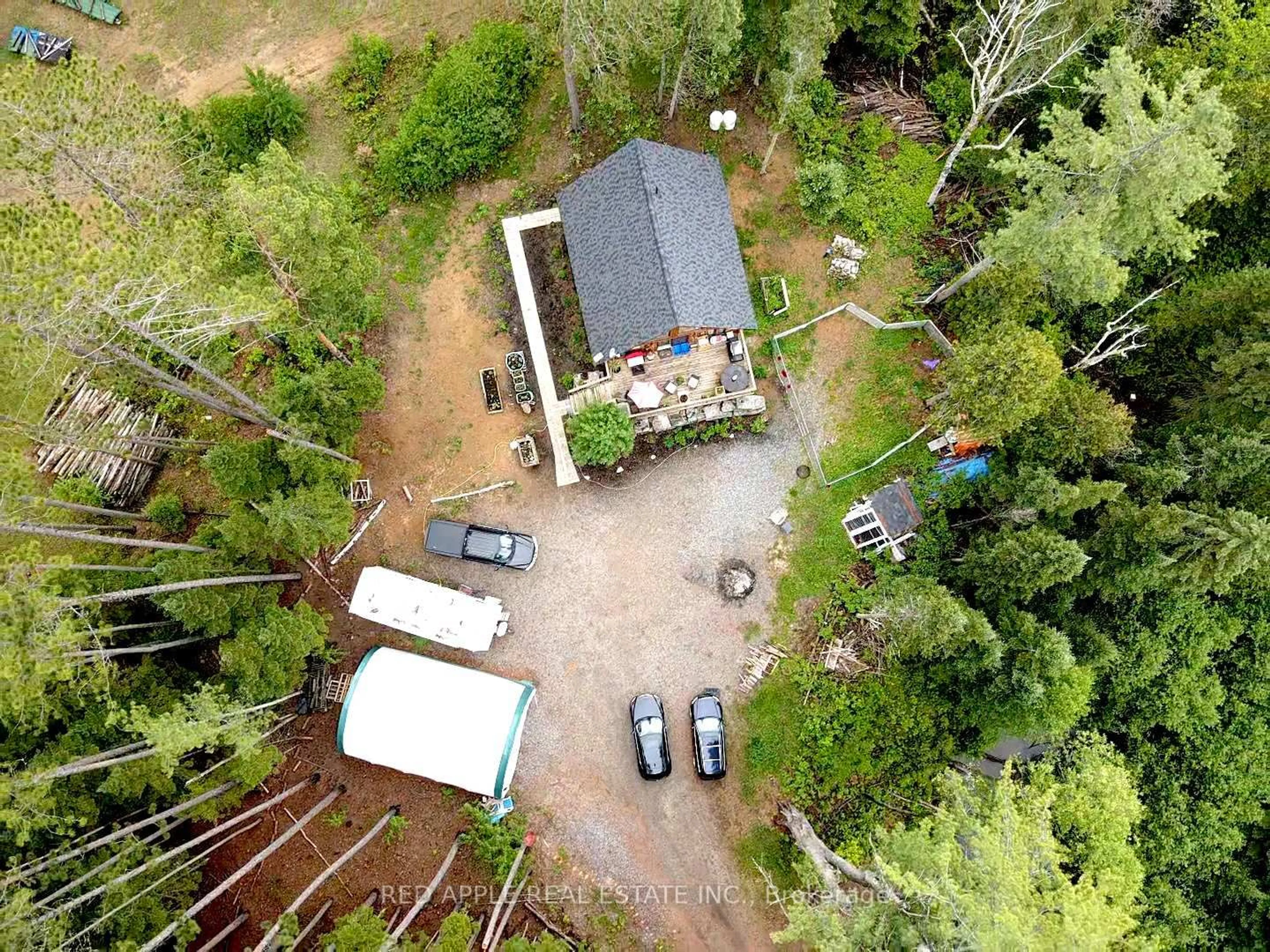 A pic from outside/outdoor area/front of a property/back of a property/a pic from drone, forest/trees view for 1392 Carroll Rd, Dysart et al Ontario K0M 1S0