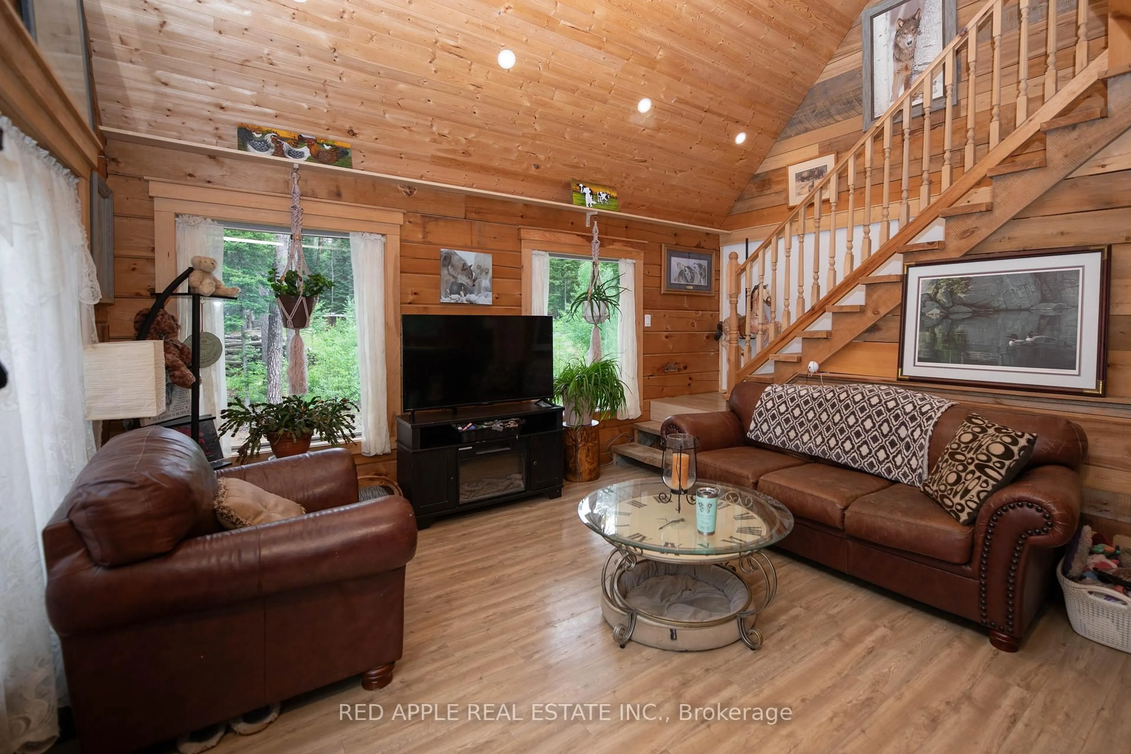 Living room with furniture, wood/laminate floor for 1392 Carroll Rd, Dysart et al Ontario K0M 1S0