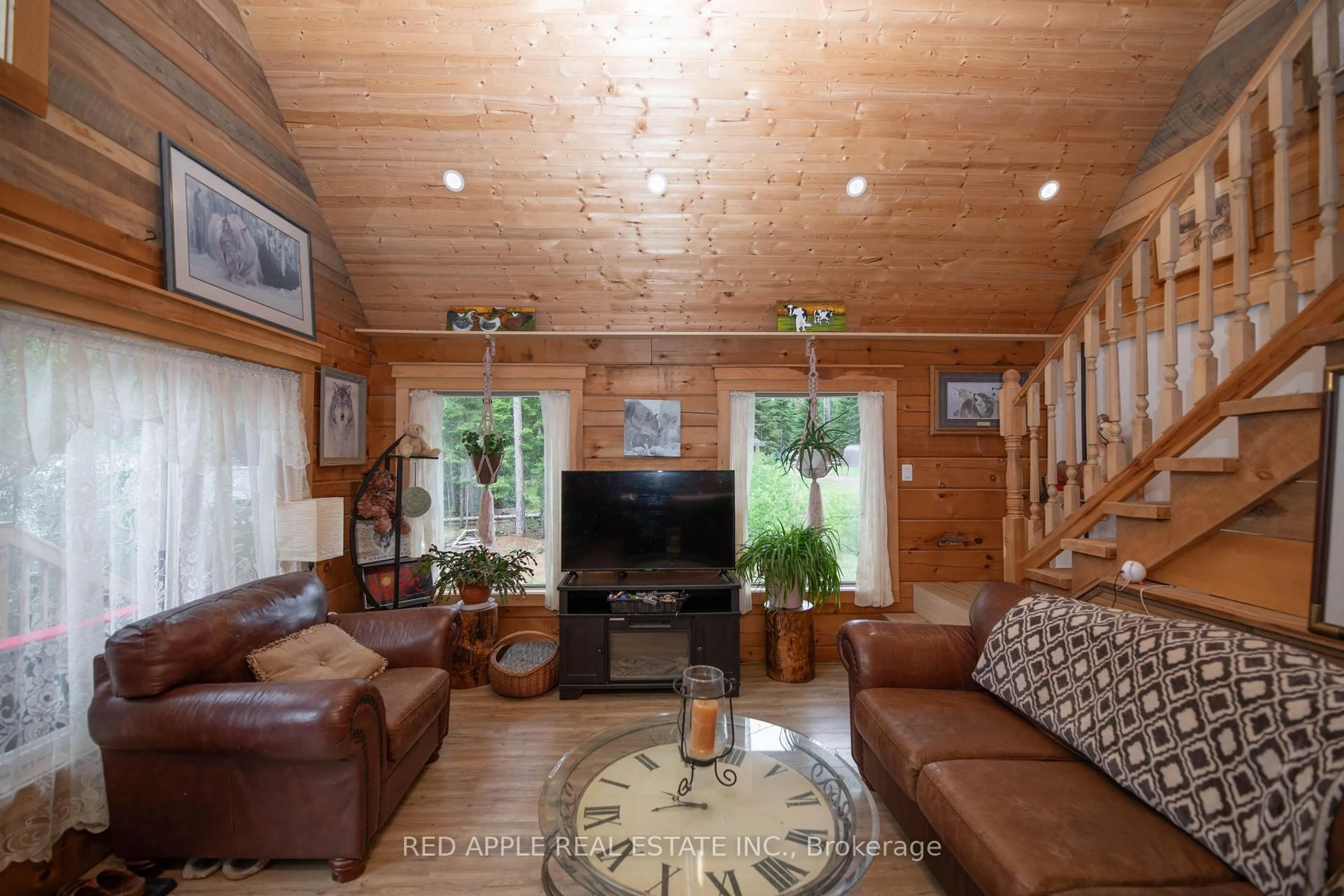 Living room with furniture, wood/laminate floor for 1392 Carroll Rd, Dysart et al Ontario K0M 1S0