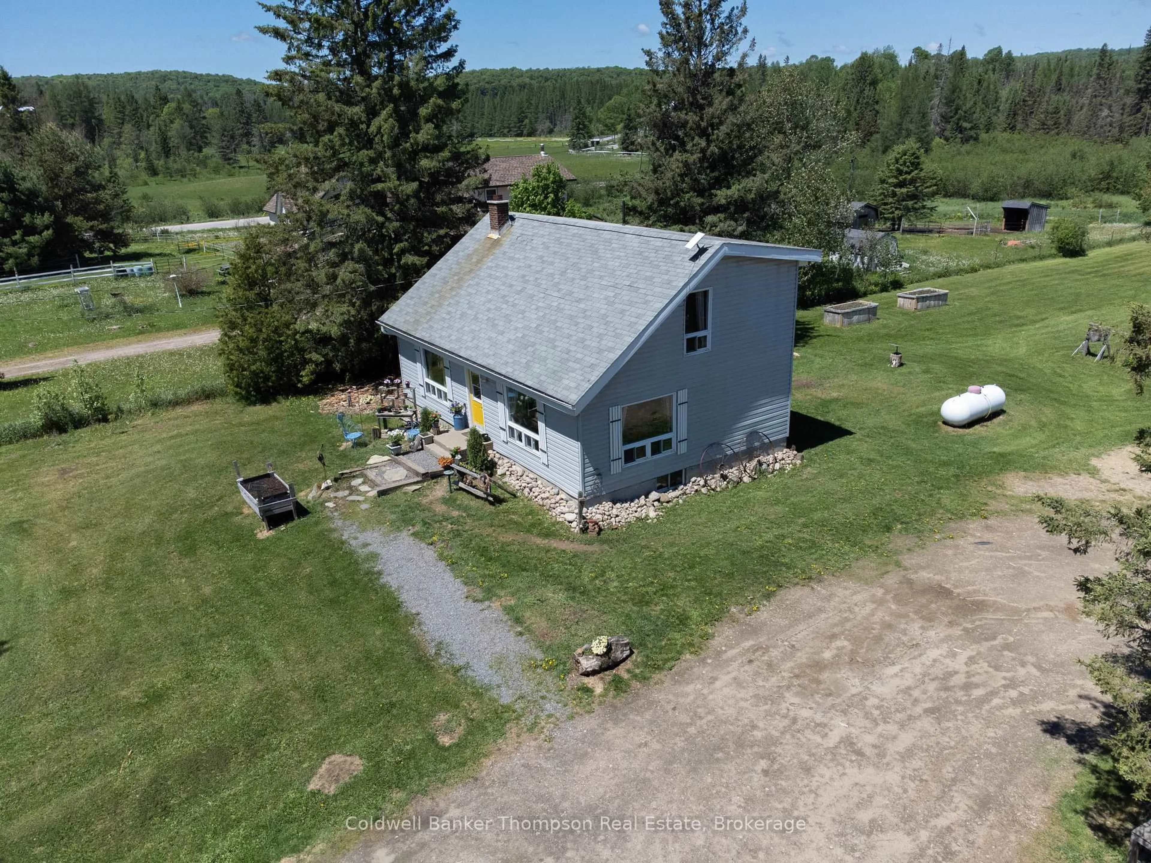A pic from outside/outdoor area/front of a property/back of a property/a pic from drone, water/lake/river/ocean view for 1202 Eagle Lake Rd, Machar Ontario P0A 1X0