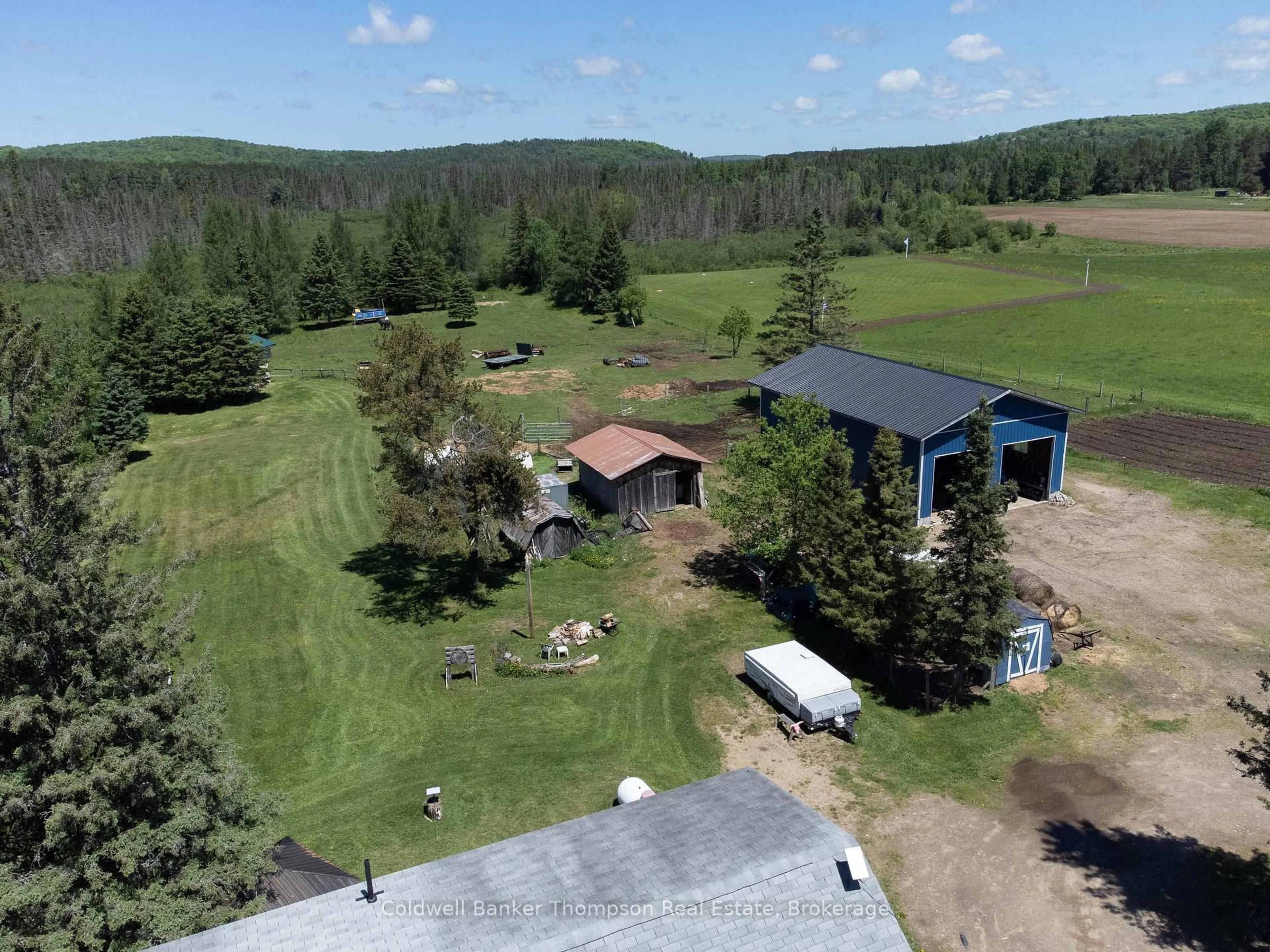 A pic from outside/outdoor area/front of a property/back of a property/a pic from drone, mountain view for 1202 Eagle Lake Rd, Machar Ontario P0A 1X0