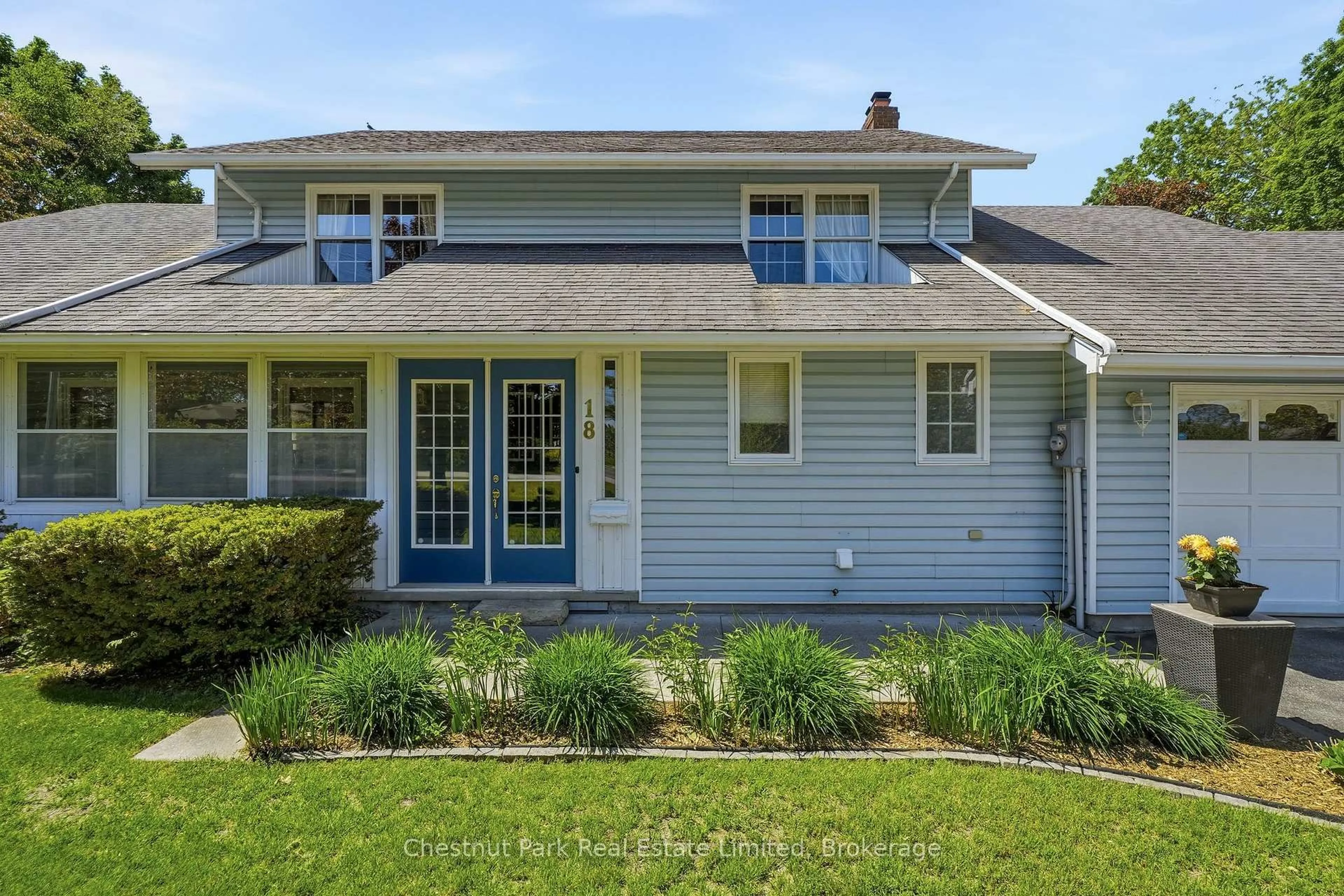 Home with vinyl exterior material, street for 18 Carriage Lane, Quinte West Ontario K0K 1L0
