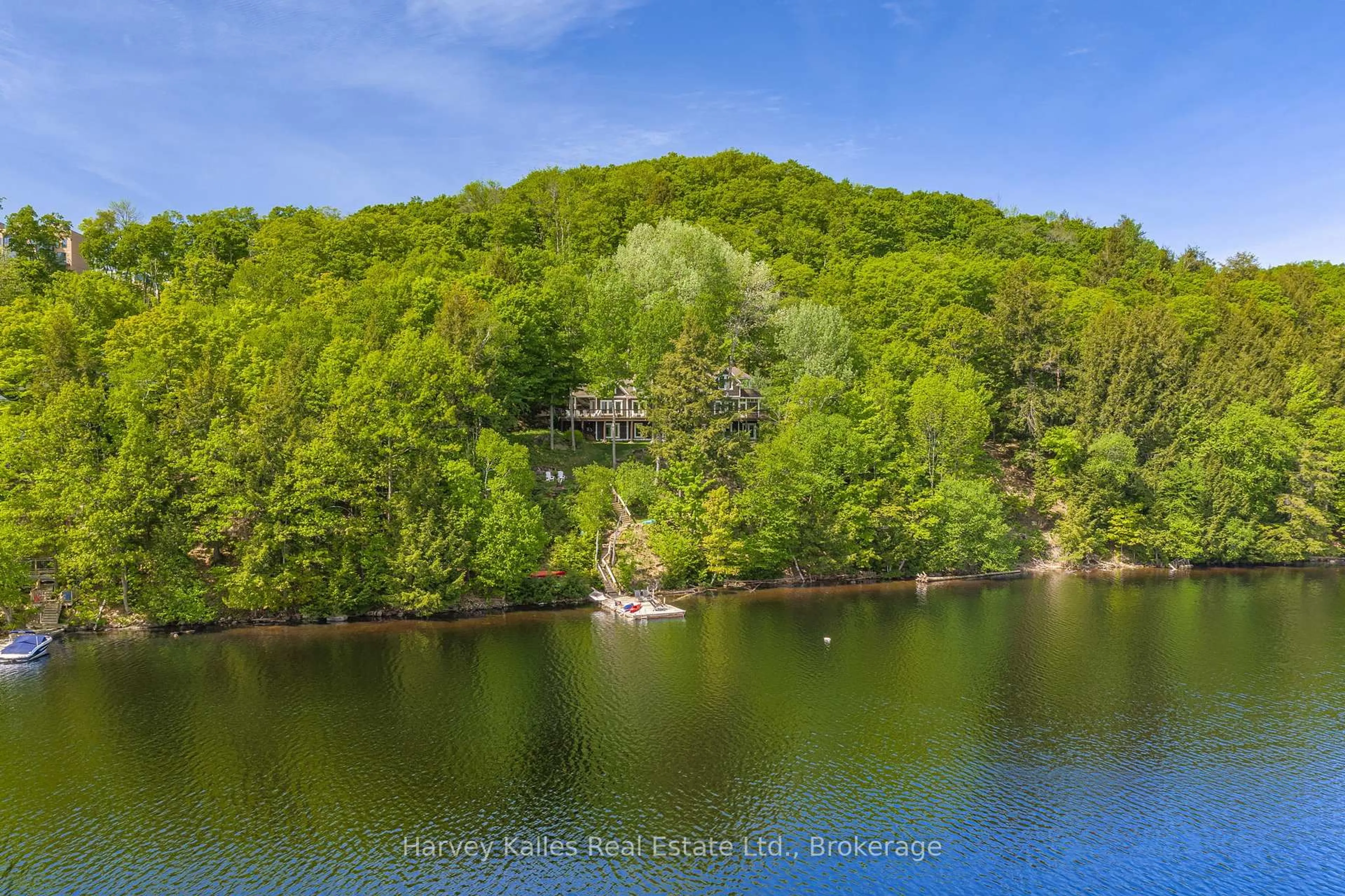 A pic from outside/outdoor area/front of a property/back of a property/a pic from drone, water/lake/river/ocean view for 161 Town Line Rd, Huntsville Ontario P1H 1R1
