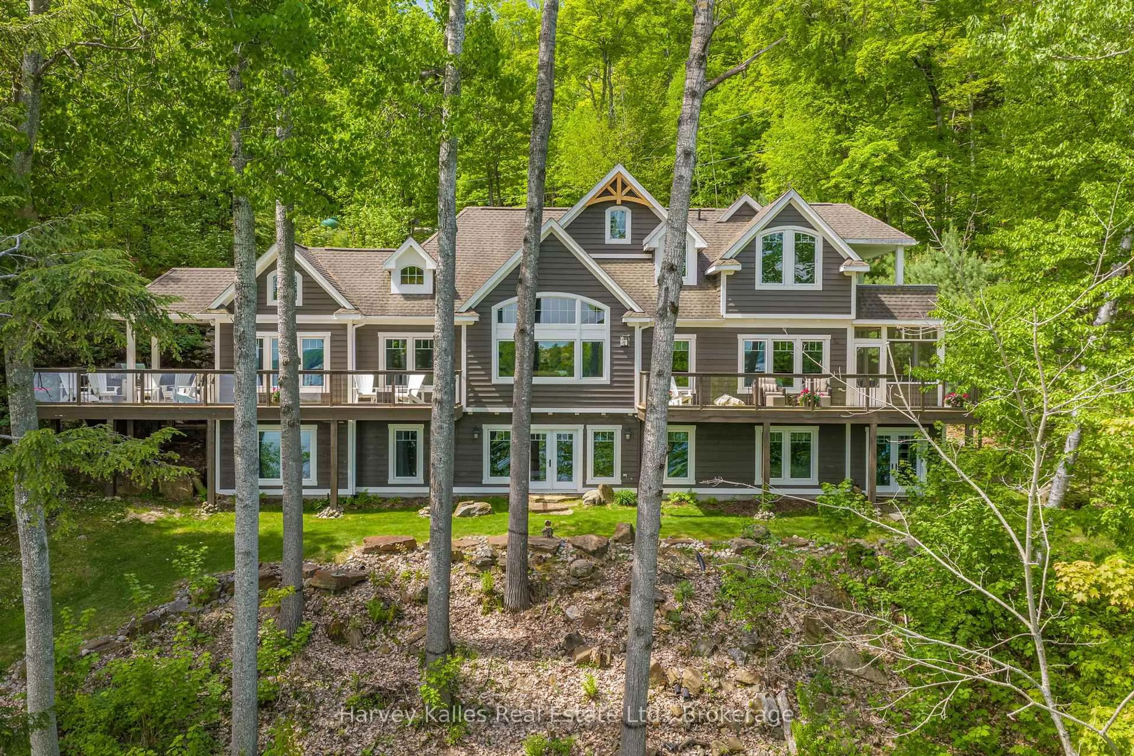 A pic from outside/outdoor area/front of a property/back of a property/a pic from drone, forest/trees view for 161 Town Line Rd, Huntsville Ontario P1H 1R1