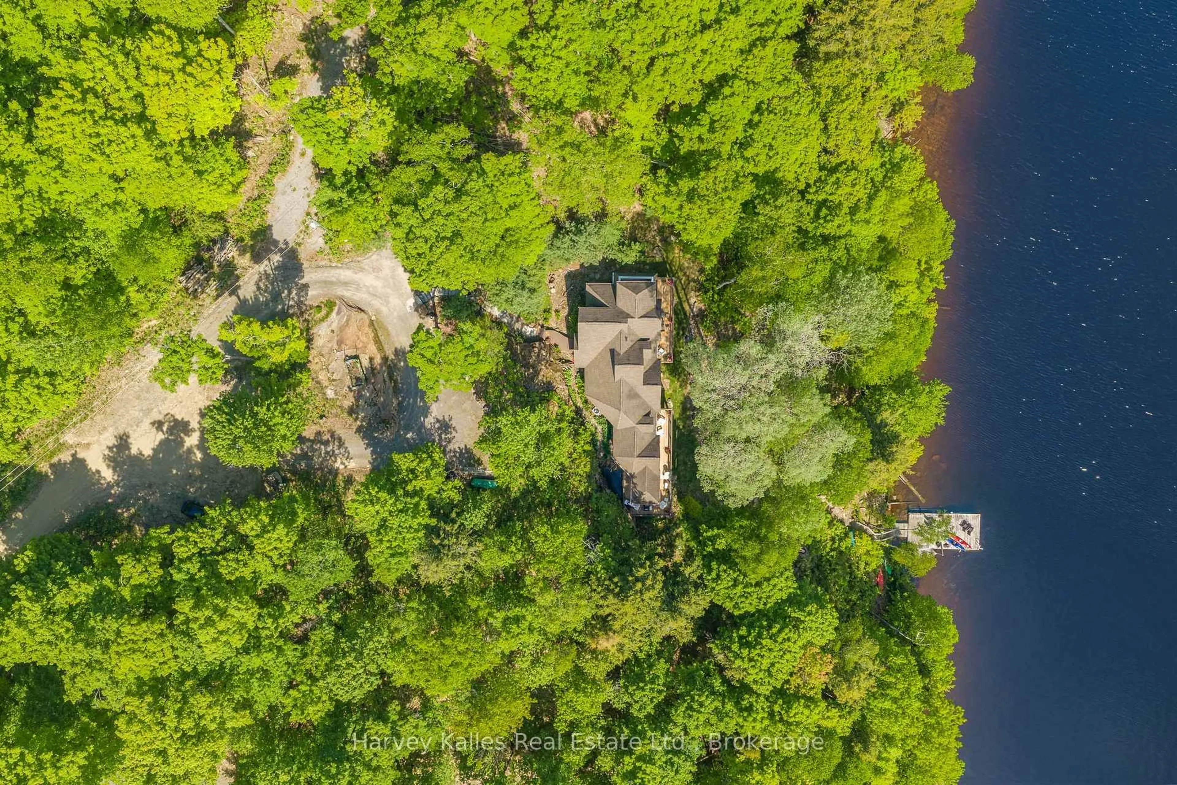 A pic from outside/outdoor area/front of a property/back of a property/a pic from drone, water/lake/river/ocean view for 161 Town Line Rd, Huntsville Ontario P1H 1R1