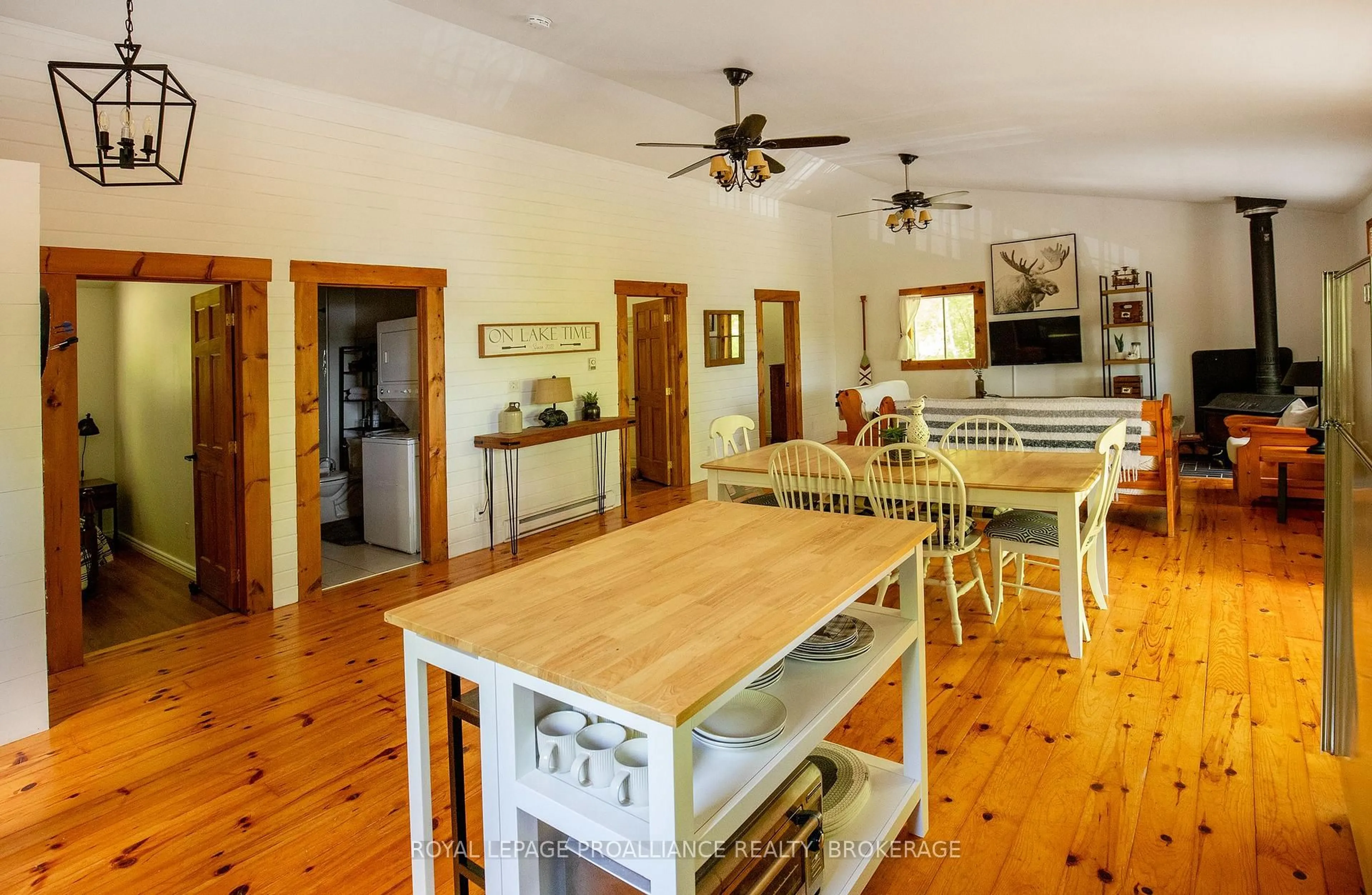 Open concept kitchen, wood/laminate floor for 1101 Price Rd, Arden Ontario K0H 1B0