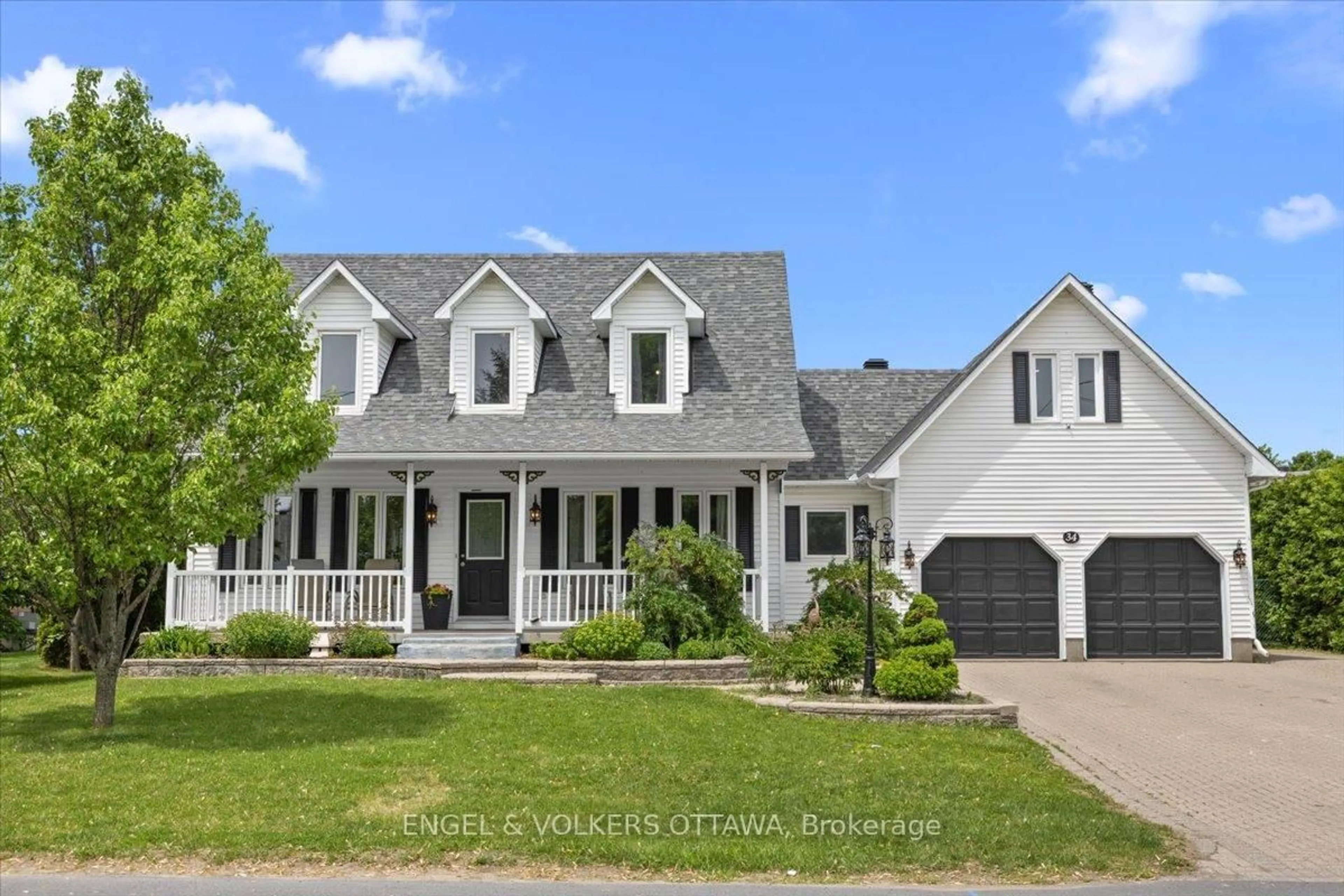Home with vinyl exterior material, street for 34 Percy St, Casselman Ontario K0A 1M0